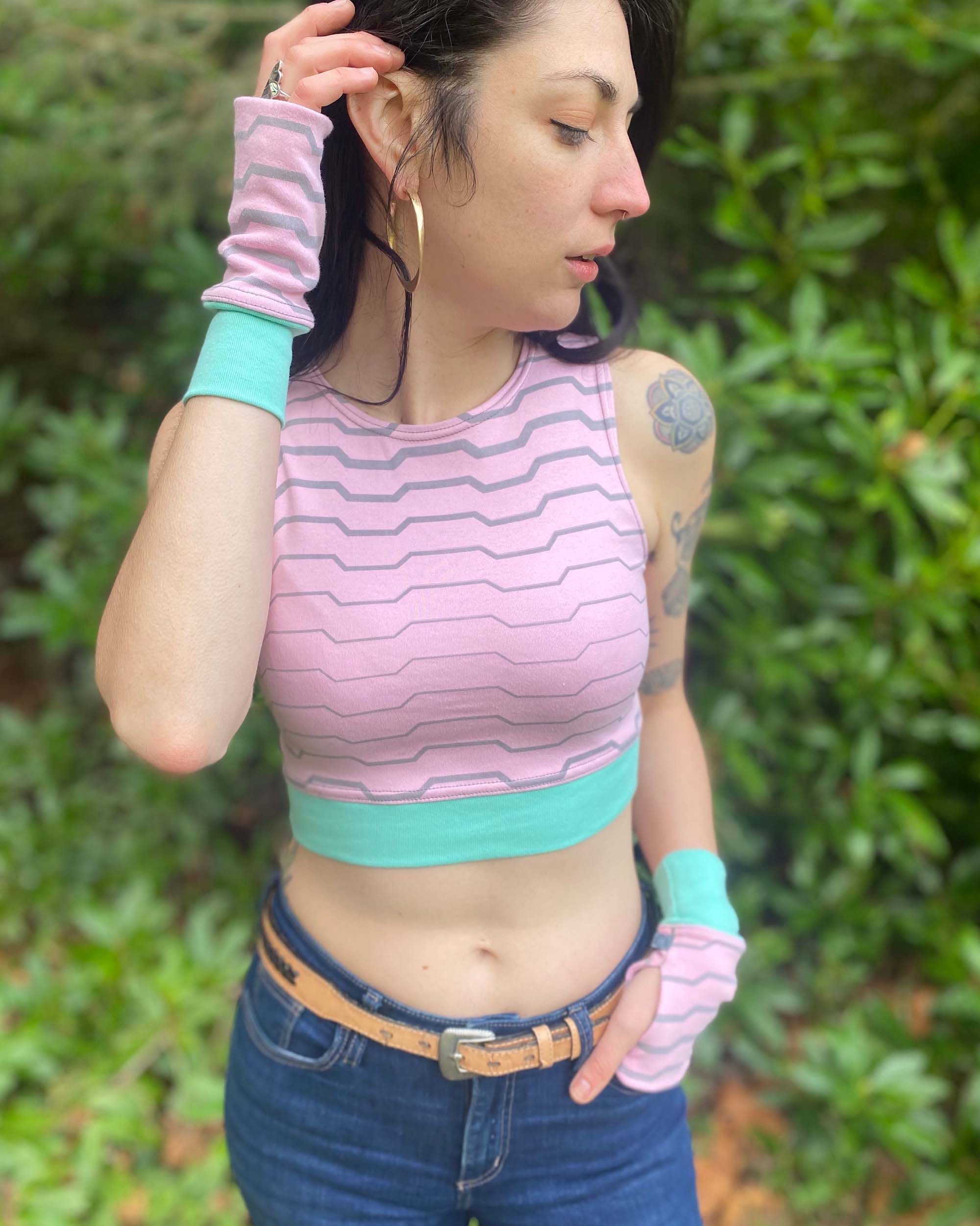 Organic cotton fingerless gloves and crop top in pink fabric with geometric print.