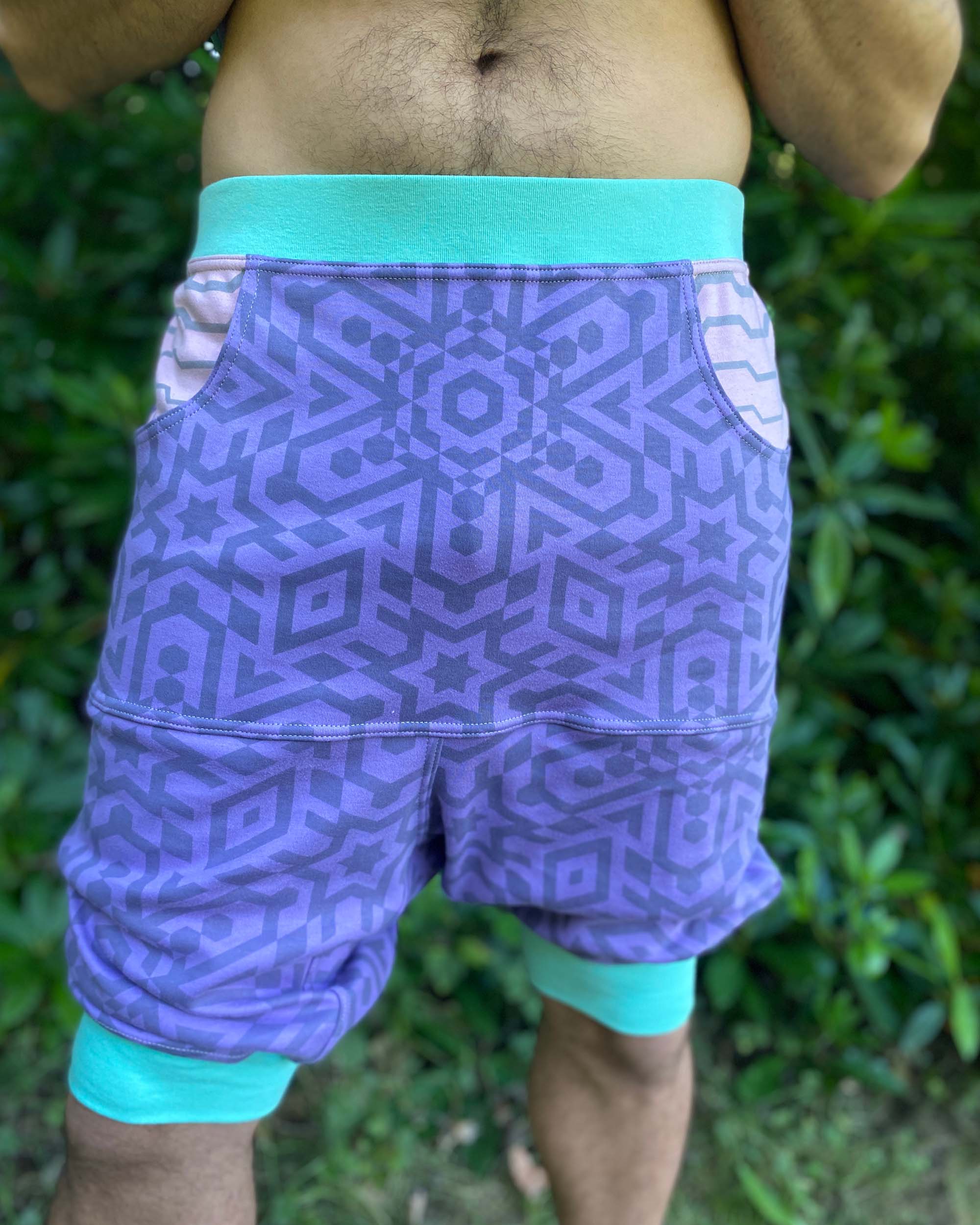 Organic cotton drop crotch shorts, lavender fabric with geometric print, detail view of the fabric.