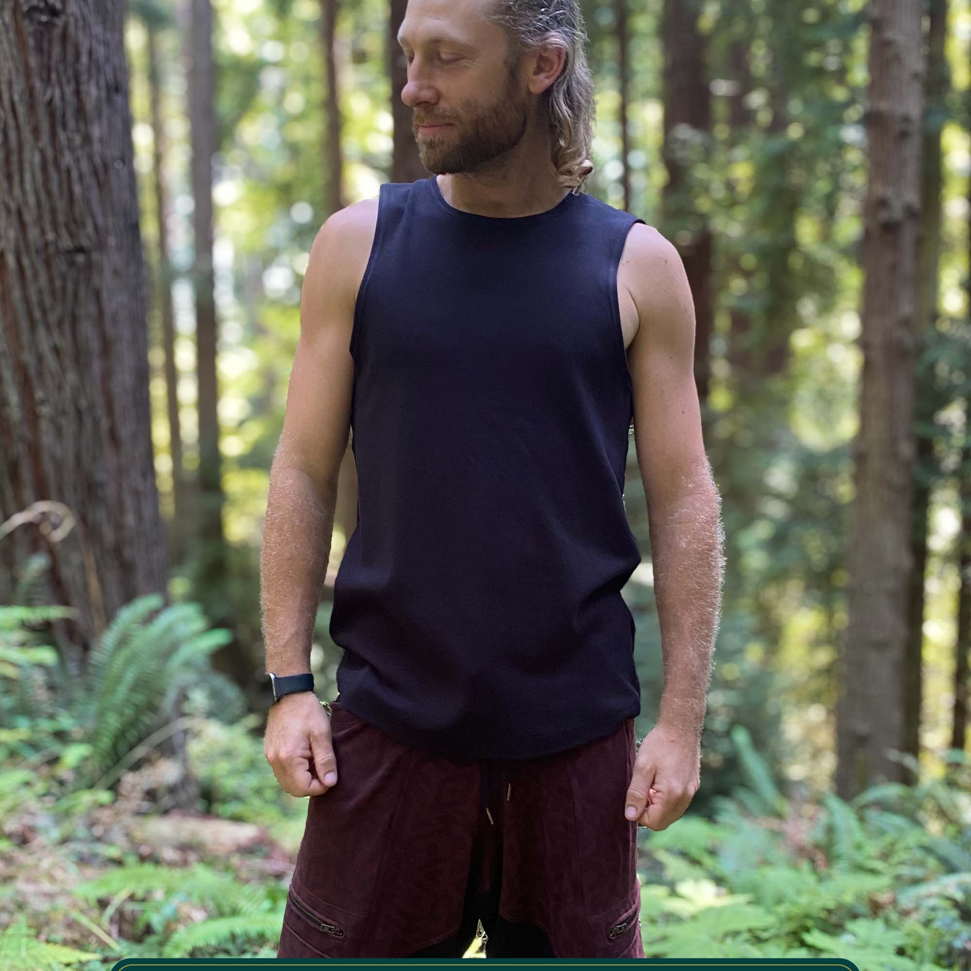 Organic cotton mens tank top, black  fabric, front view on model.