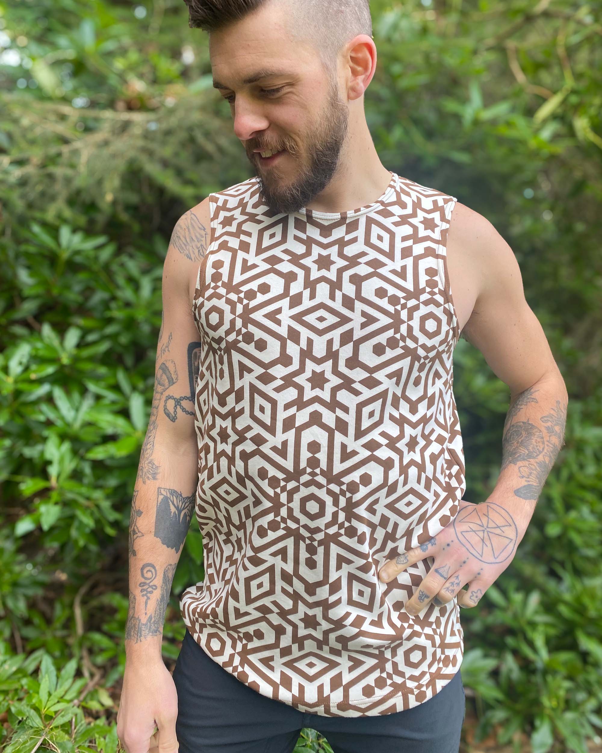 Organic cotton mens tank top, un-dyed fabric with brown geometric print, detail view.