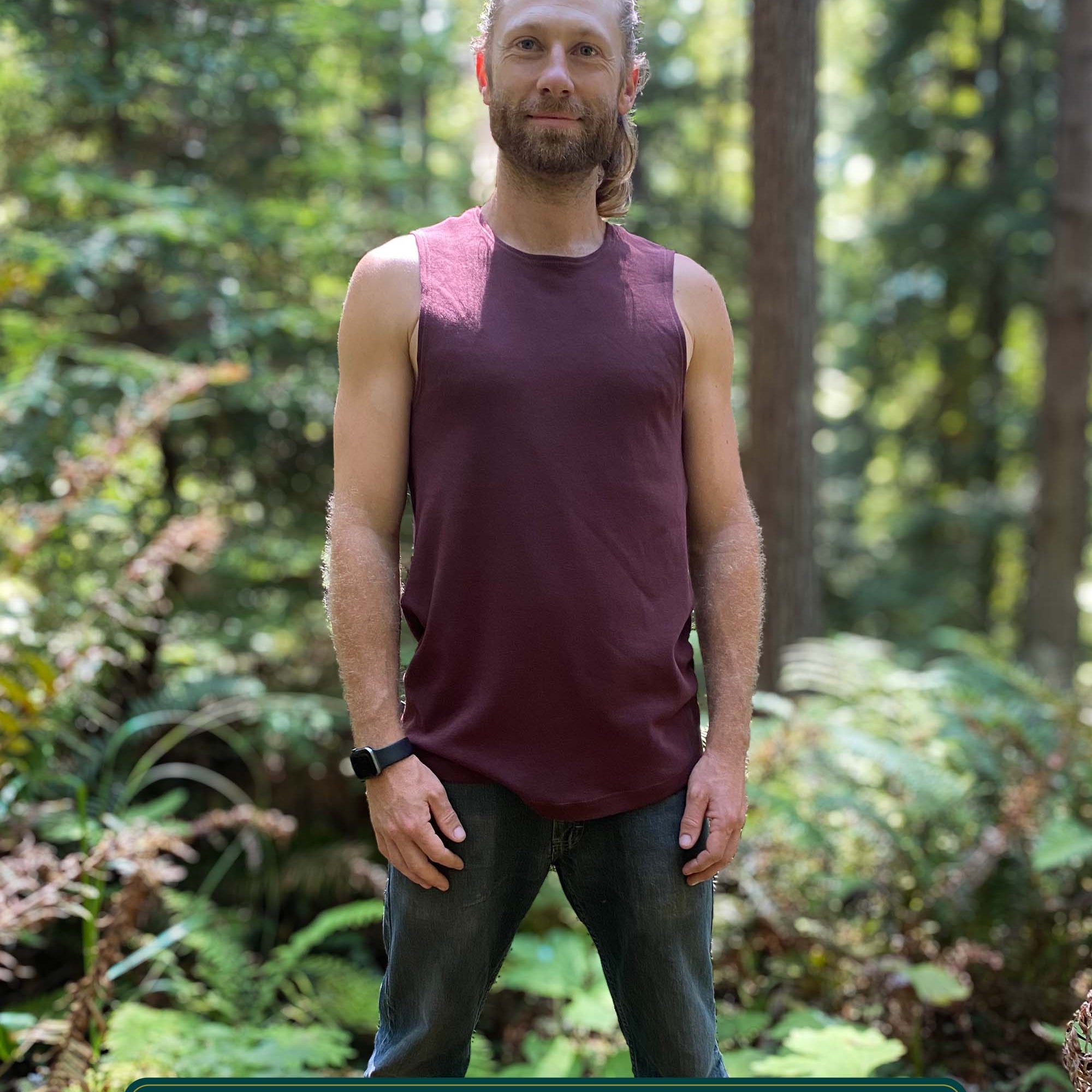 Organic cotton mens tank top, brown  fabric, front view on model in nature.