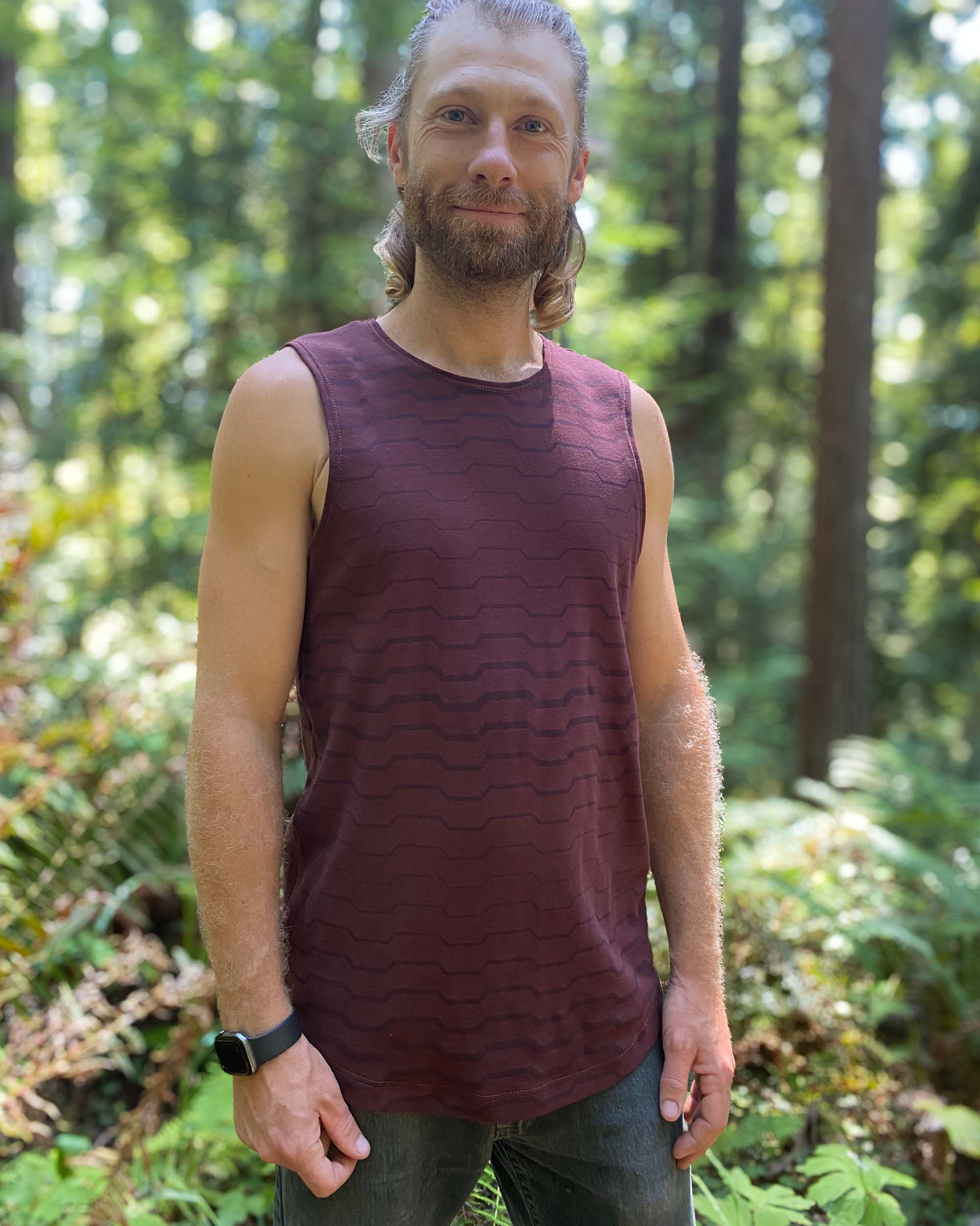 Organic cotton mens tank top, brown fabric with geo print, left side view.
