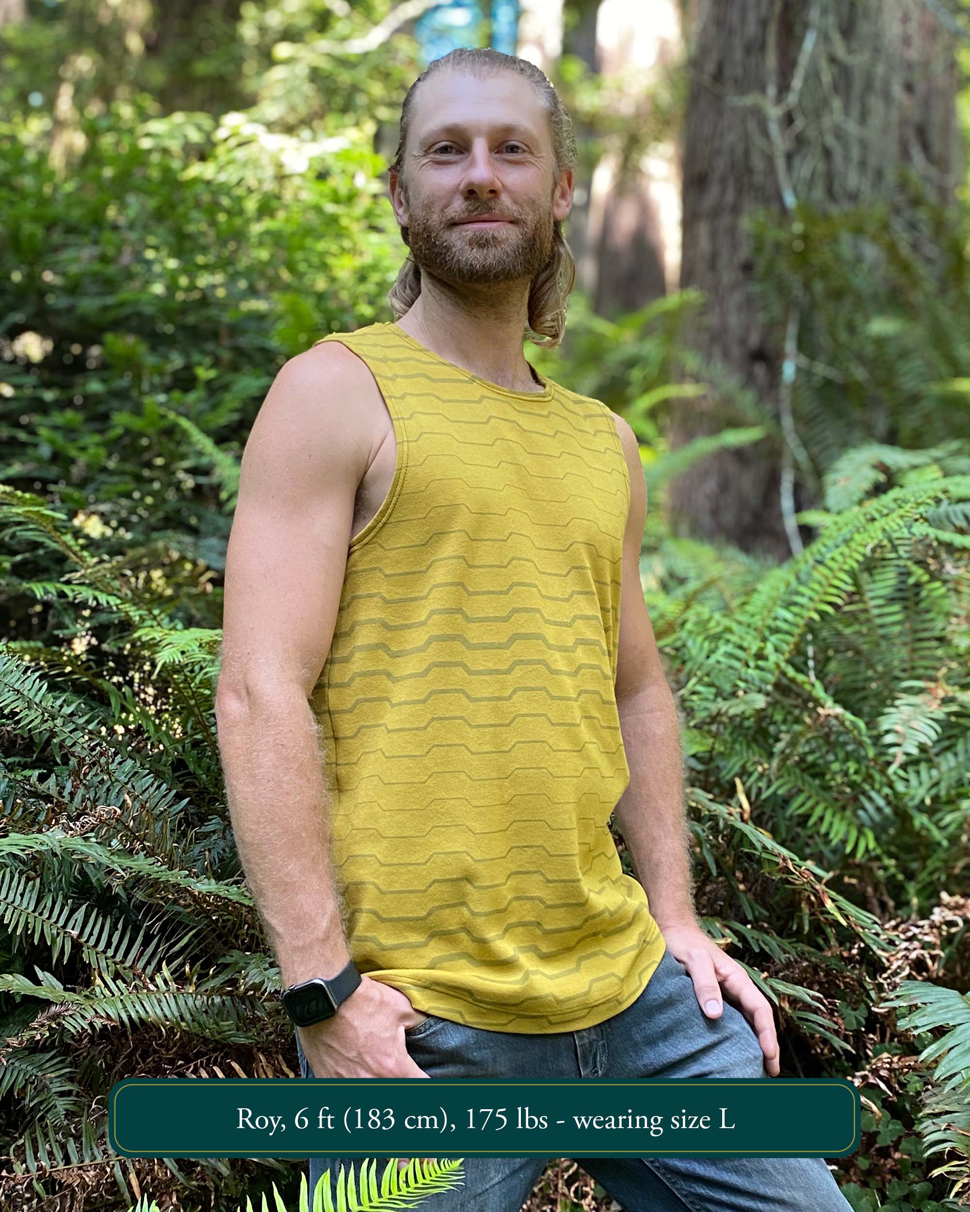 Organic cotton mens tank top, yellow fabric with geometric print, side view outdoors.