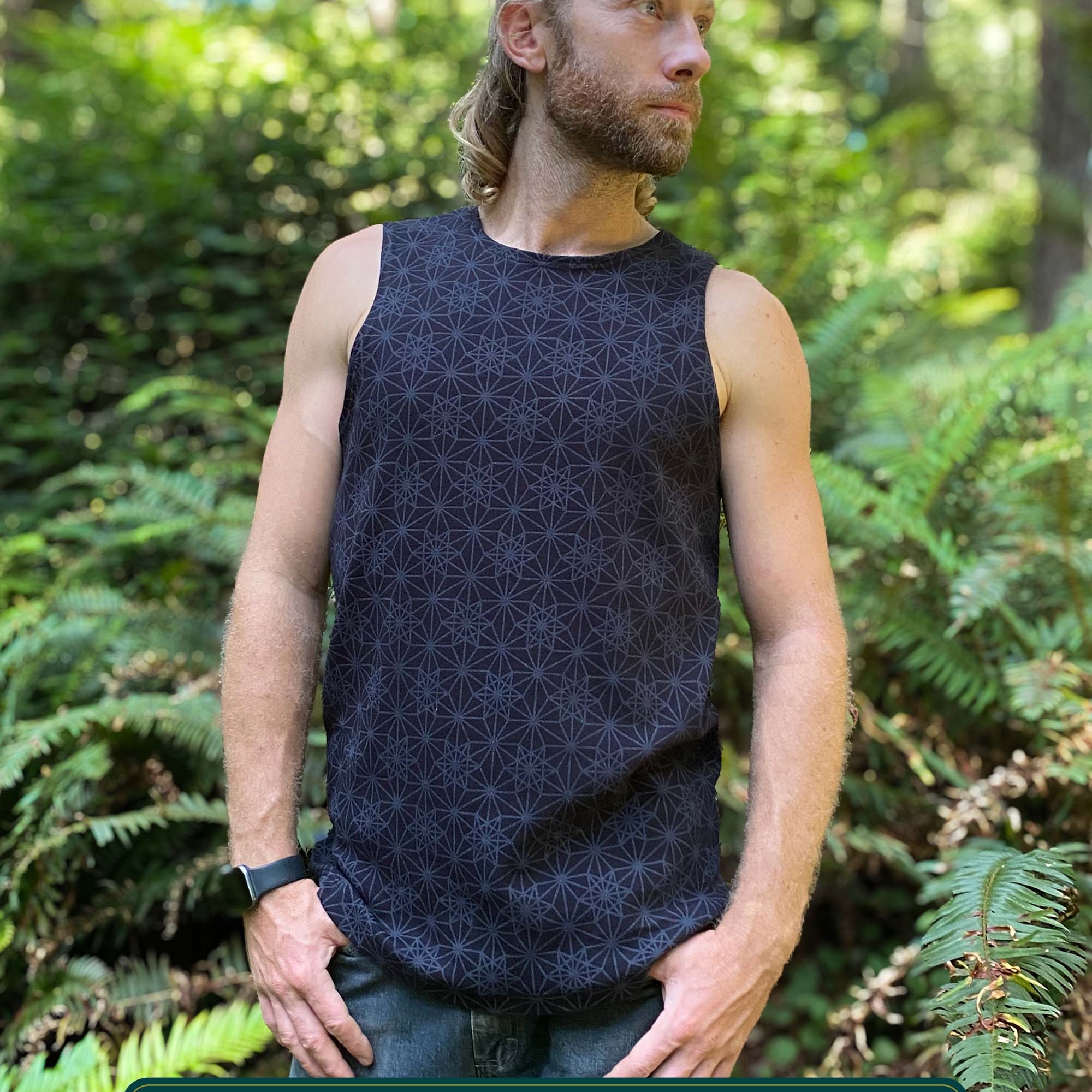Organic cotton mens tank top, black fabric with geometric print, front view.