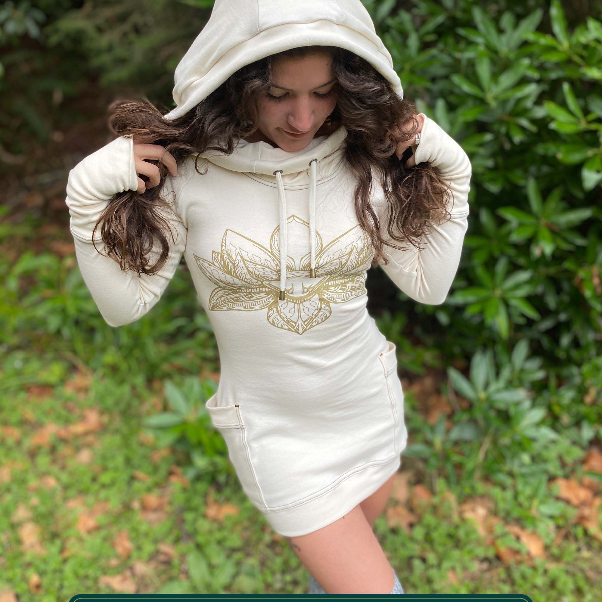 Organic cotton long sleeve tunic dress, undyed fabric with front gold lotus print, worn by female model.