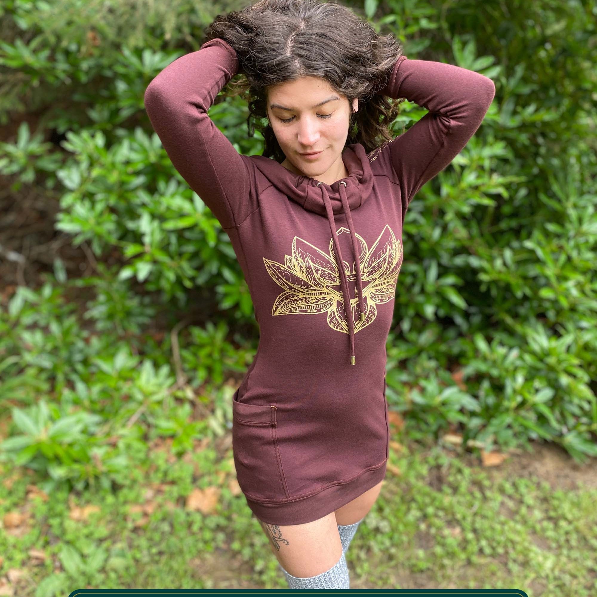 Organic cotton long sleeve tunic dress, brown with front gold lotus print, front view on female model.