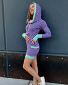Organic cotton fitted tunic dress, lavender with geometric print with, left side view on female model.