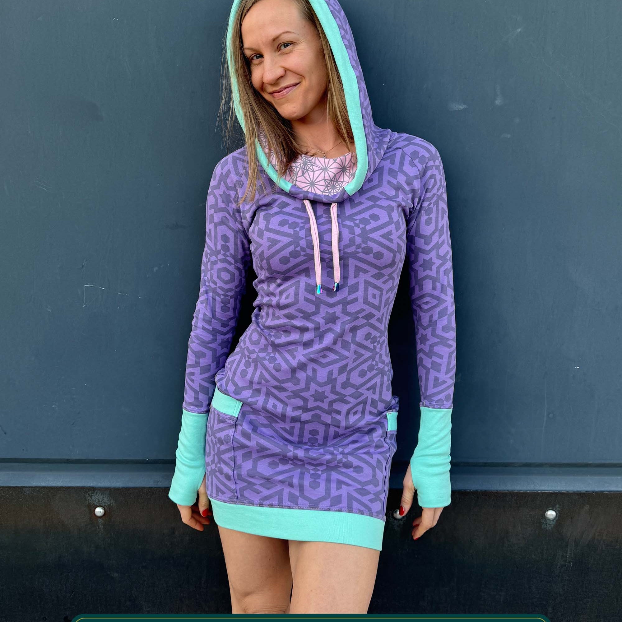 Organic cotton fitted tunic dress, lavender with geometric print, front view on female model.