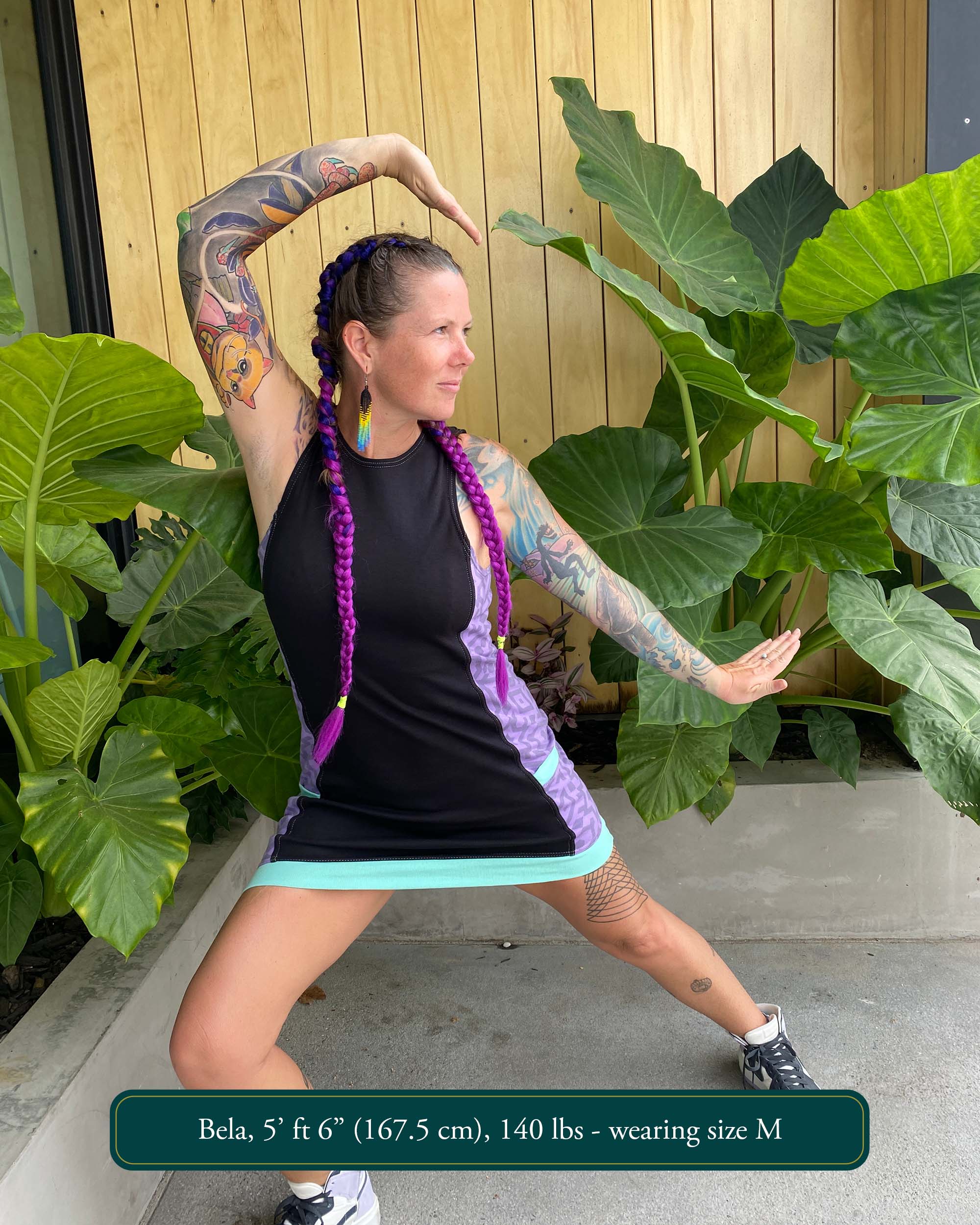 Organic cotton sleeveless dress, black fabric with lavender accent fabric and geometric print.