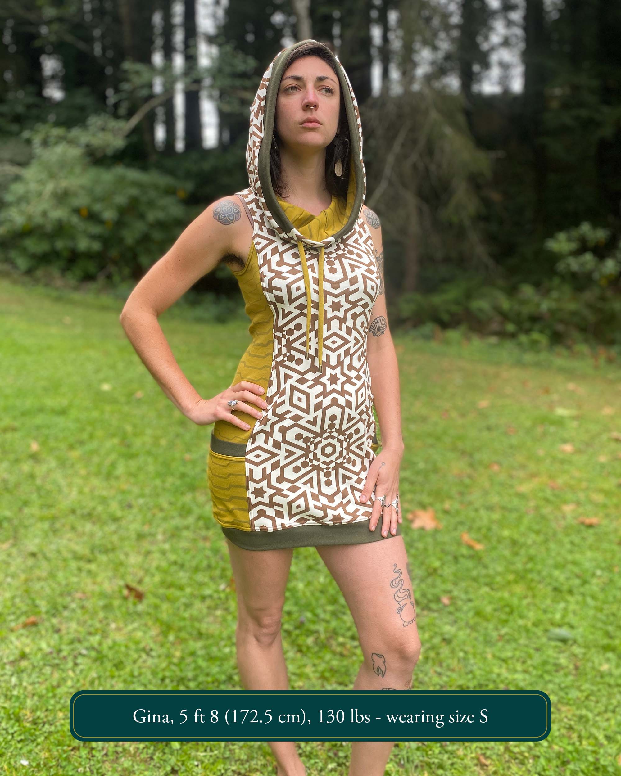 Organic cotton sleeveless hooded dress, undyed with geometric print, front view of female model.