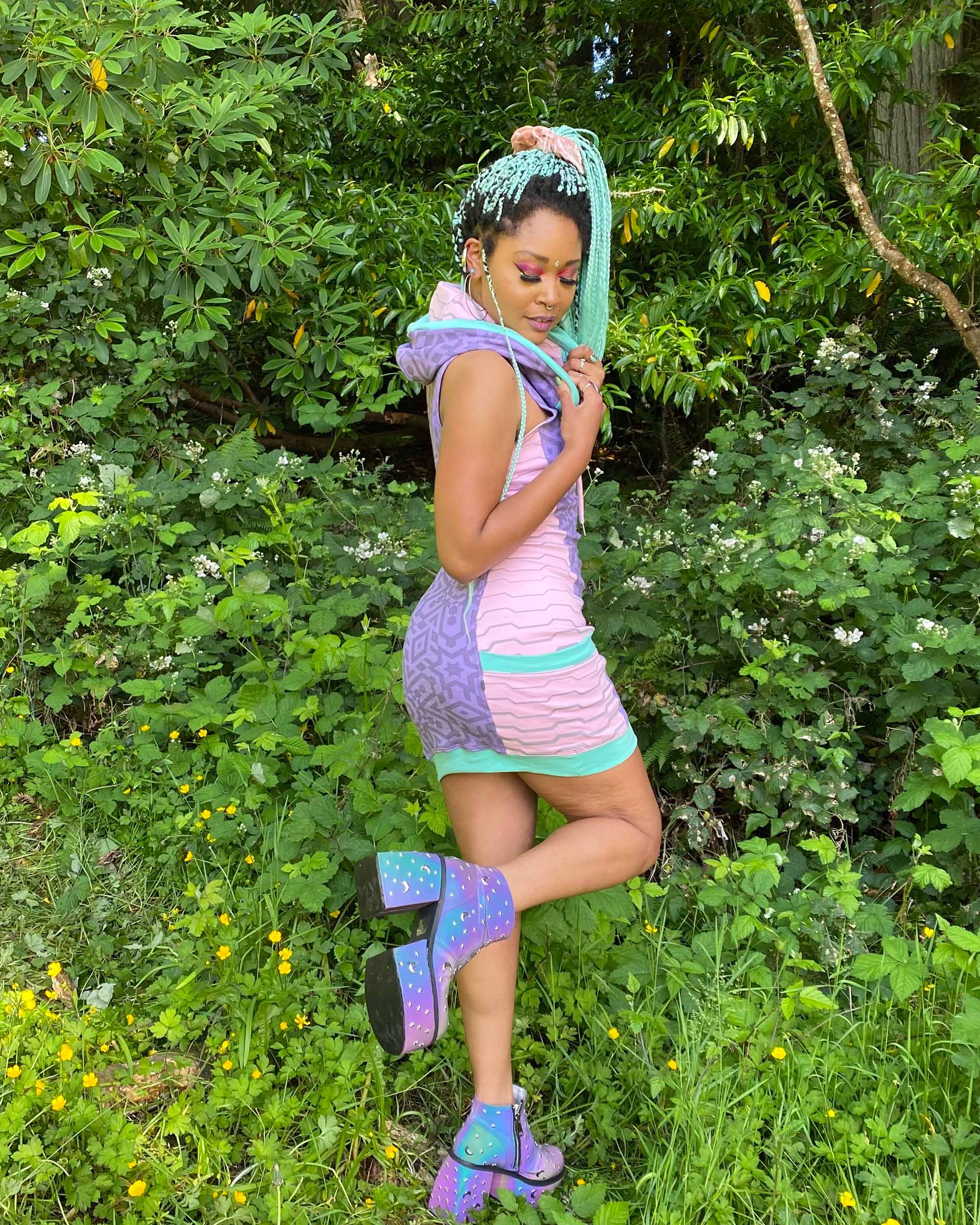 Lavender and pink sleeveless hooded dress, full body length back side view of female model.