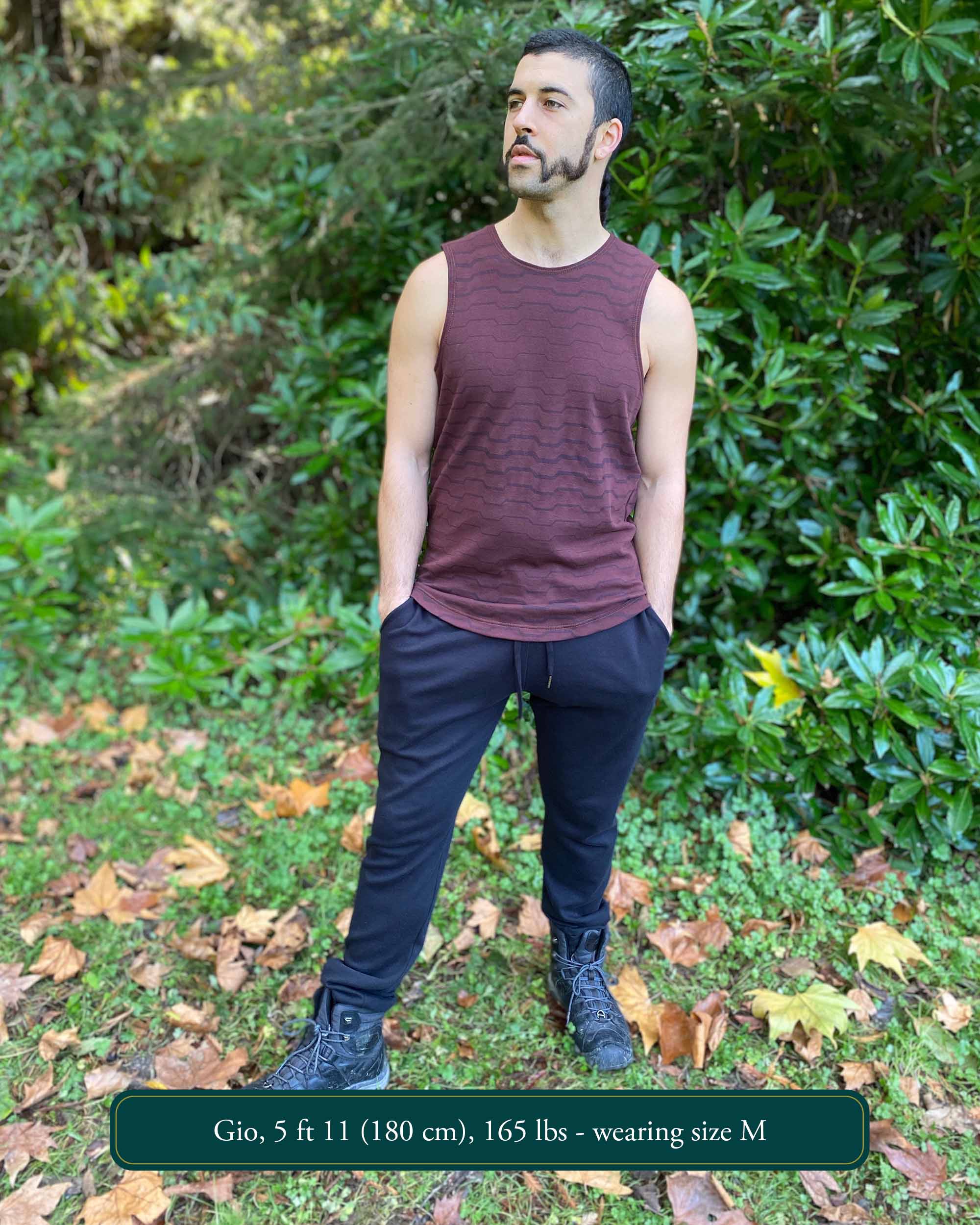 Organic cotton unisex joggers, black fabric, front view on male model.