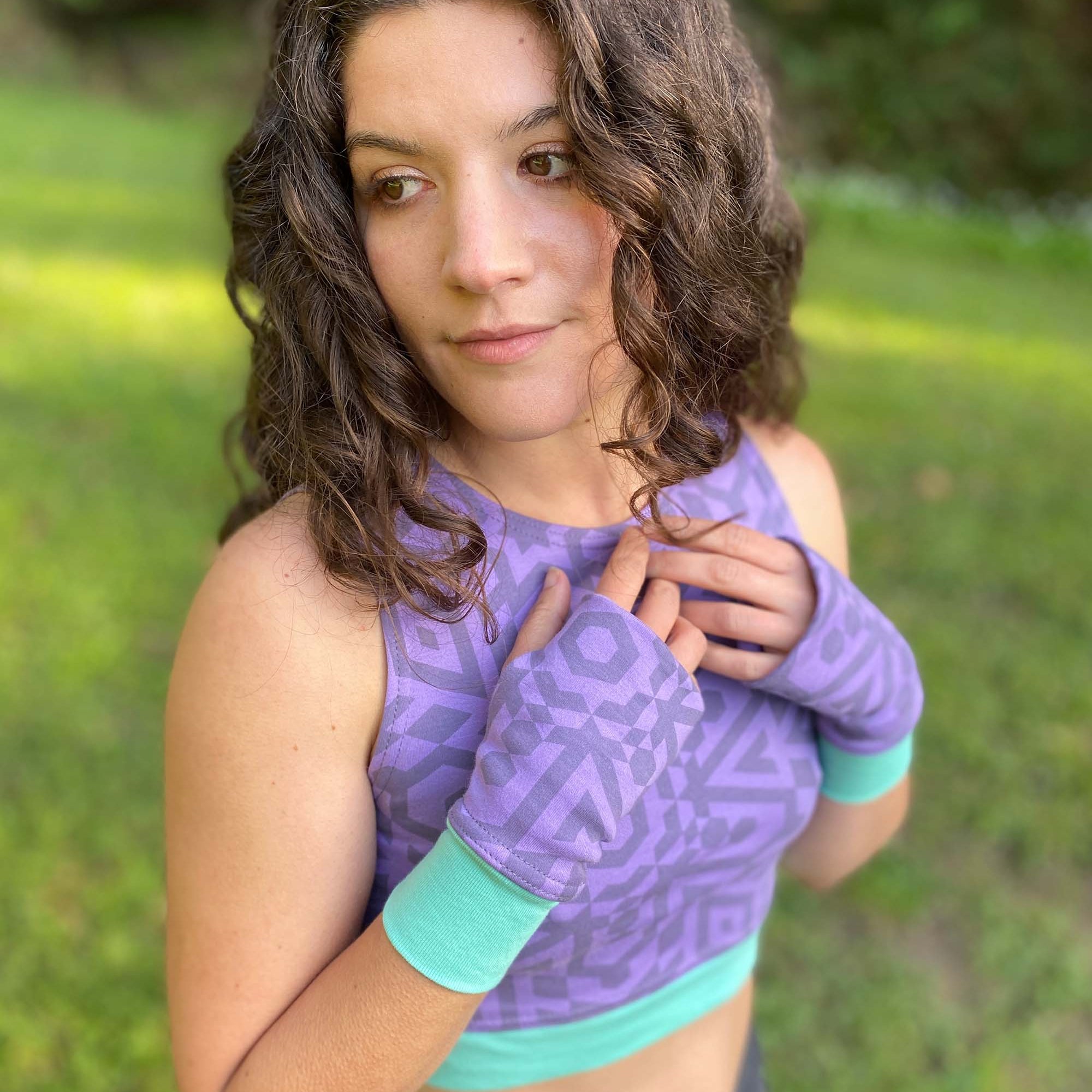 Organic cotton crop top and hand warmers in lavender fabric and geometric print, right side view on female model.