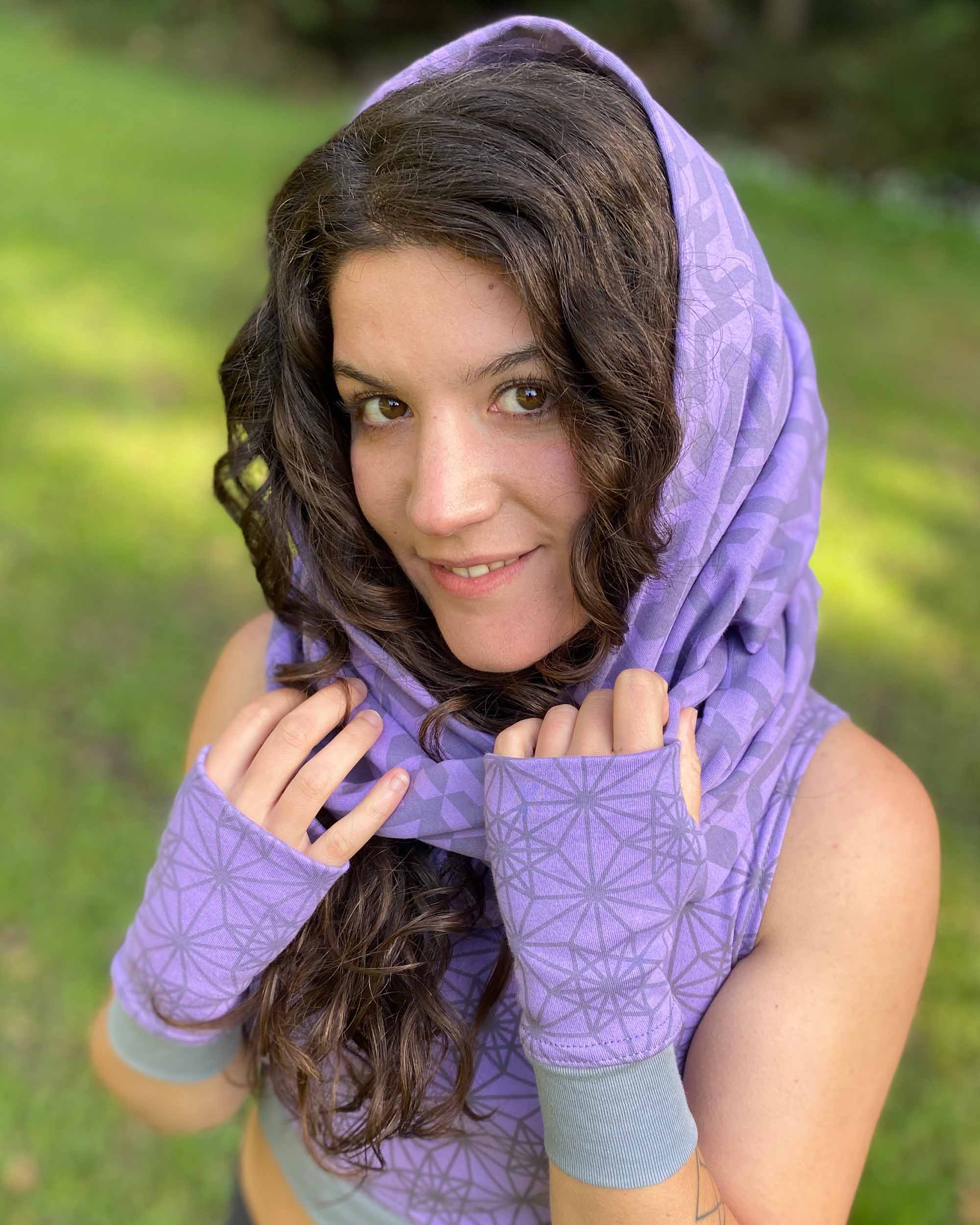 Organic cotton infinity scarf, lavender fabric with geometric print, worn as head wrap on female model.