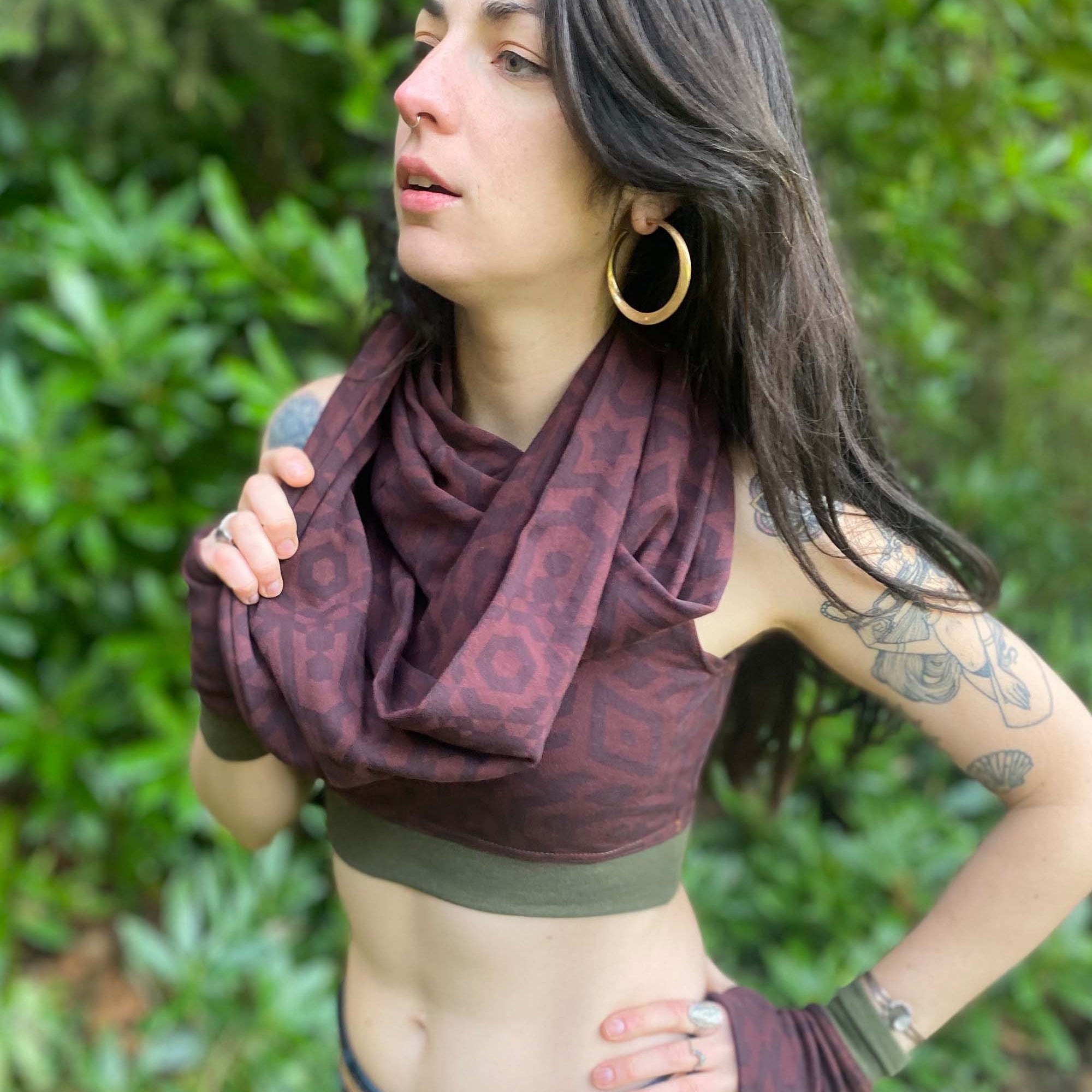 Organic cotton infinity scarf, brown fabric with sacred geometry print, right view on female model.