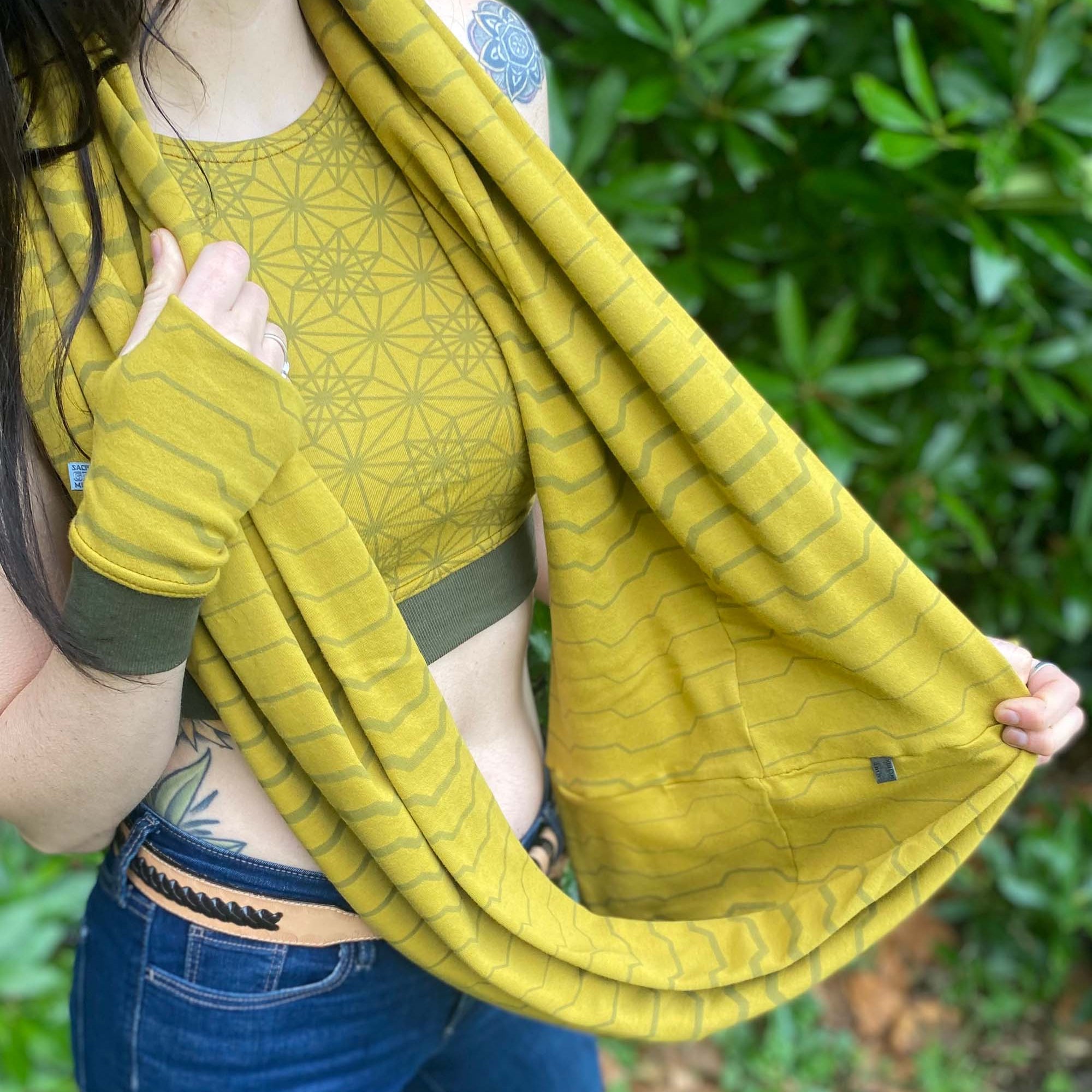 Organic cotton infinity scarf, yellow fabric with geometric stripes, detail view of fabric.