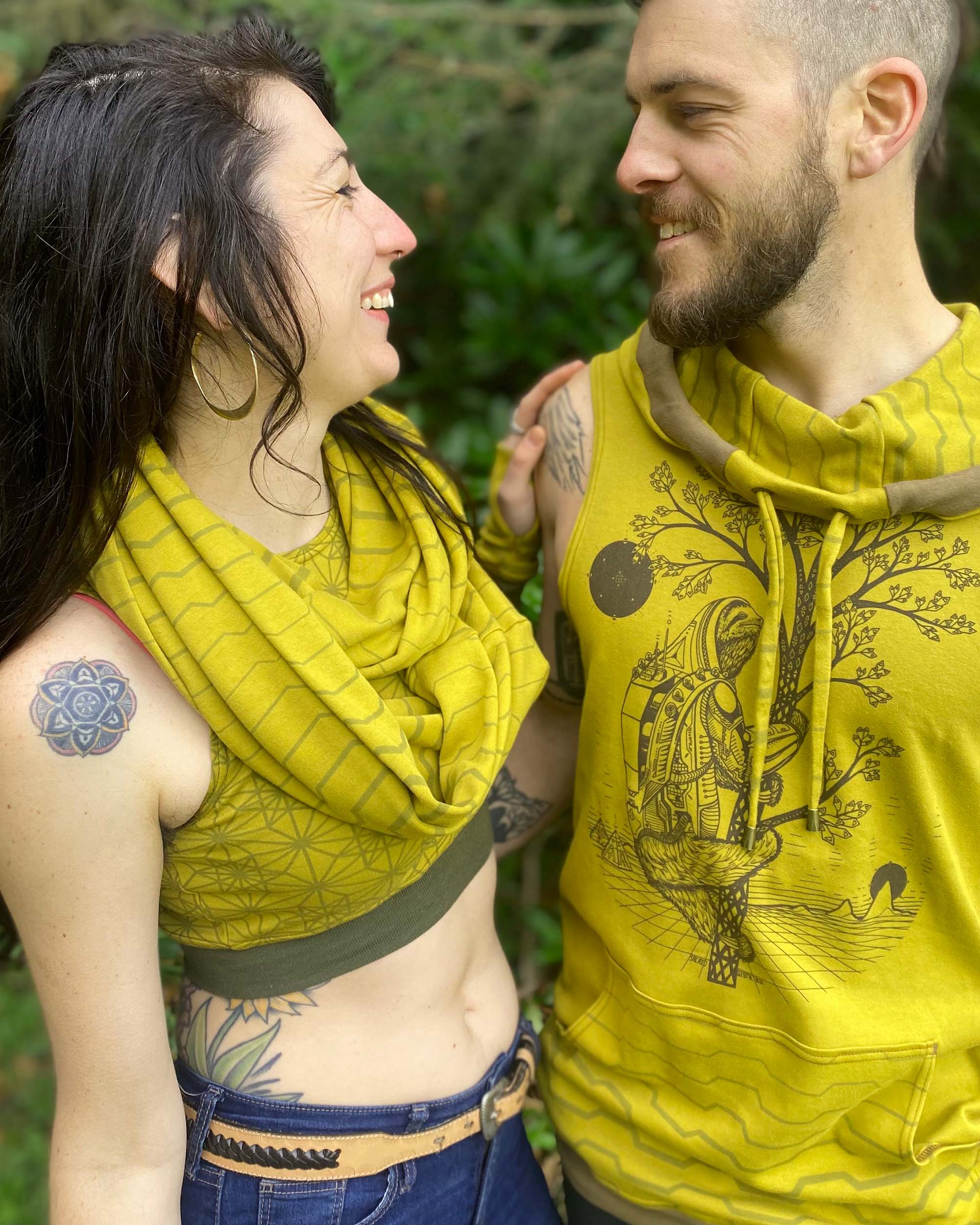 2 models with matching organic yellow garments with geometric prints.