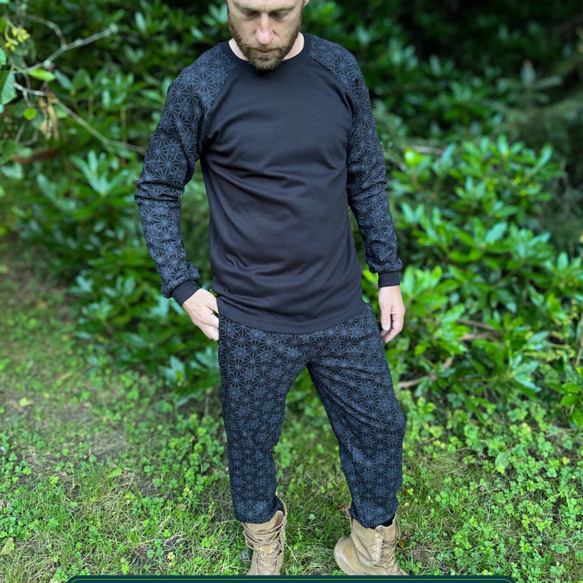 Men's matching joggers and long sleeve shirt, black with geometric printed fabric, male modeled.