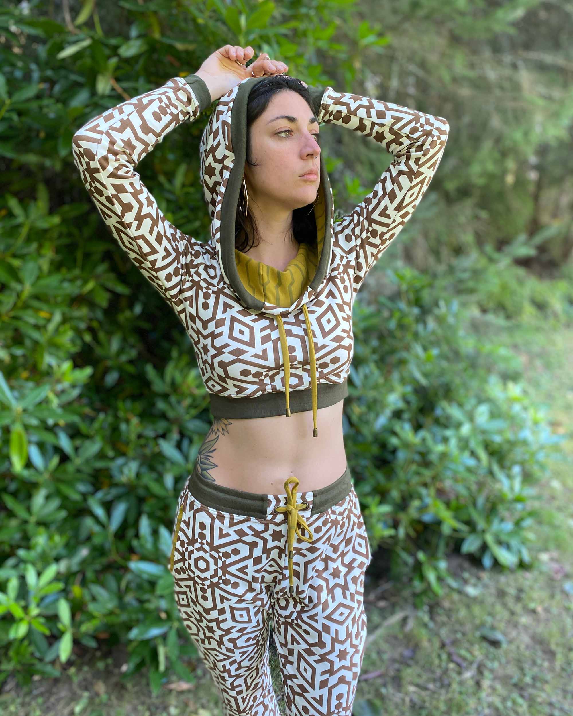 Women's matching two piece set, joggers and crop hoodie, undyed with brown print, front view on model.