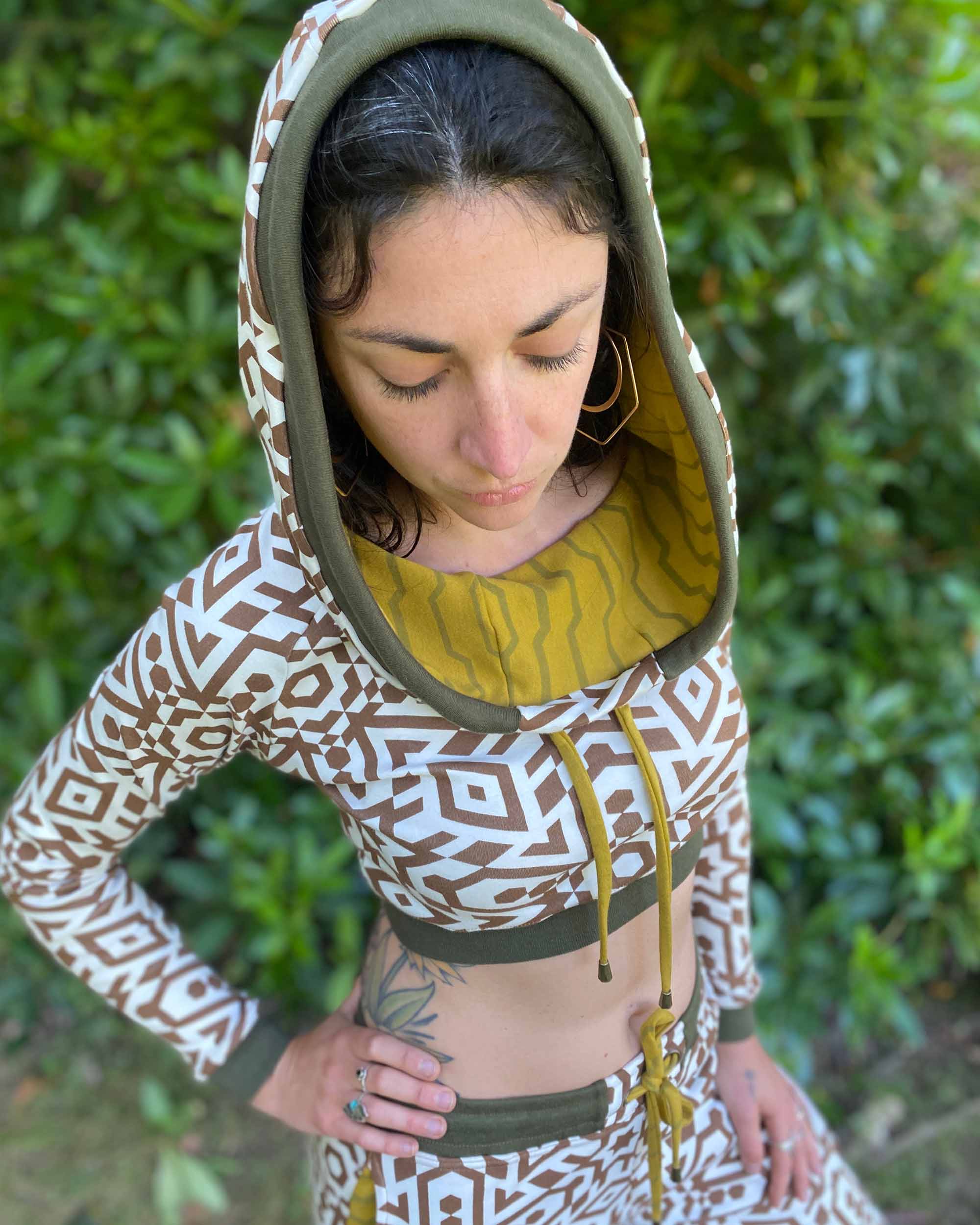 Women's matching two piece set, joggers and crop hoodie, undyed with brown geometric print, detail view of hood.