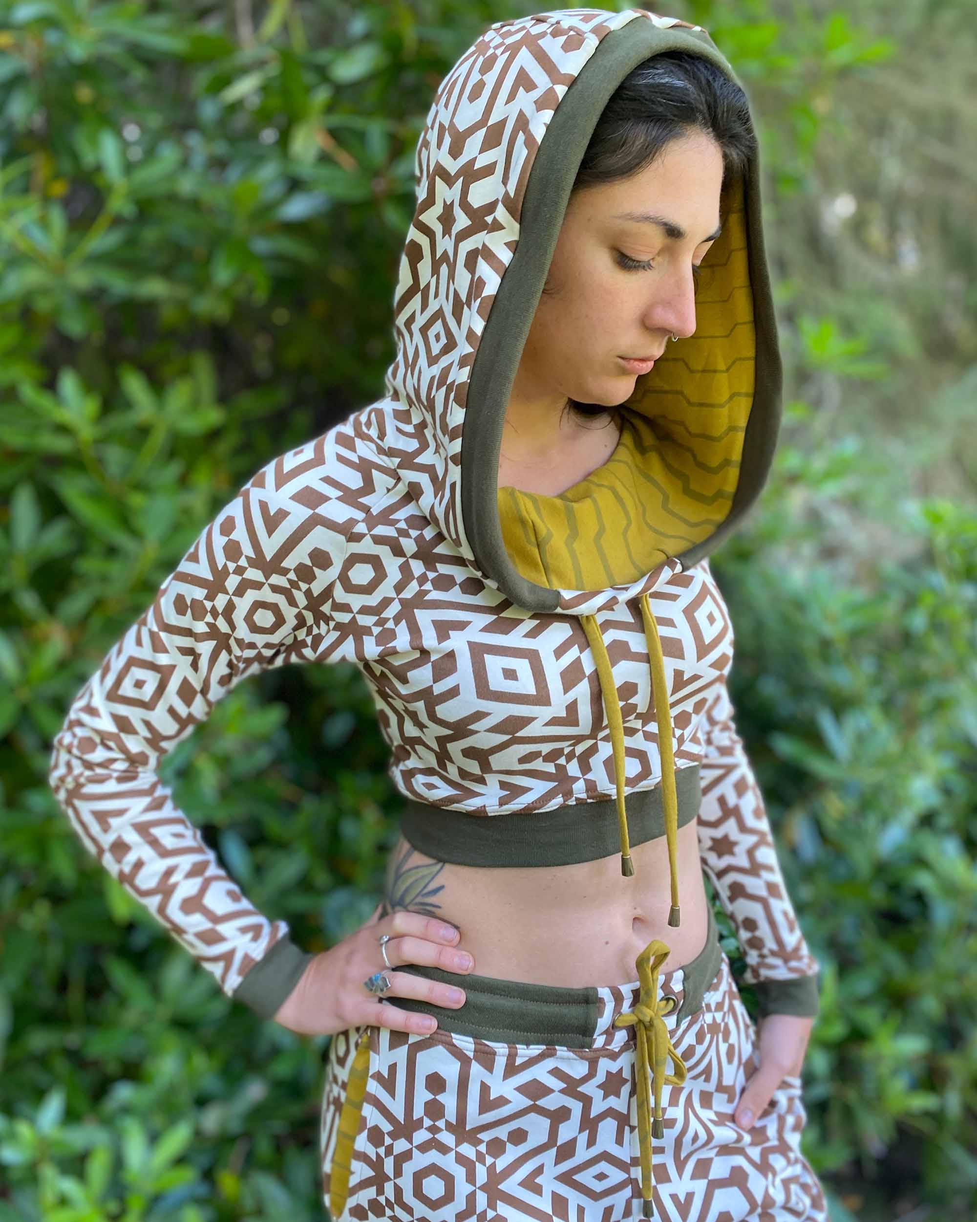 Women's matching two piece set, joggers and crop hoodie, undyed with brown geometric print with yellow accents.
