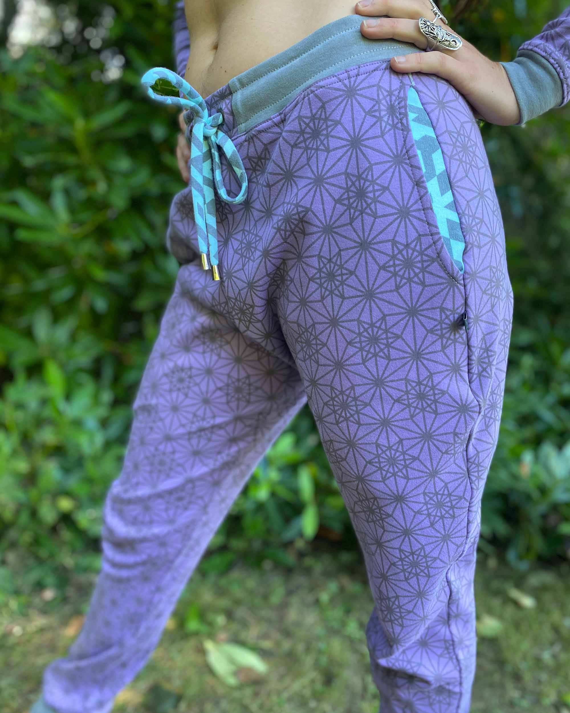 Matching two piece set, joggers and crop hoodie, lavender with sacred geometry fabric, detail view of pockets.