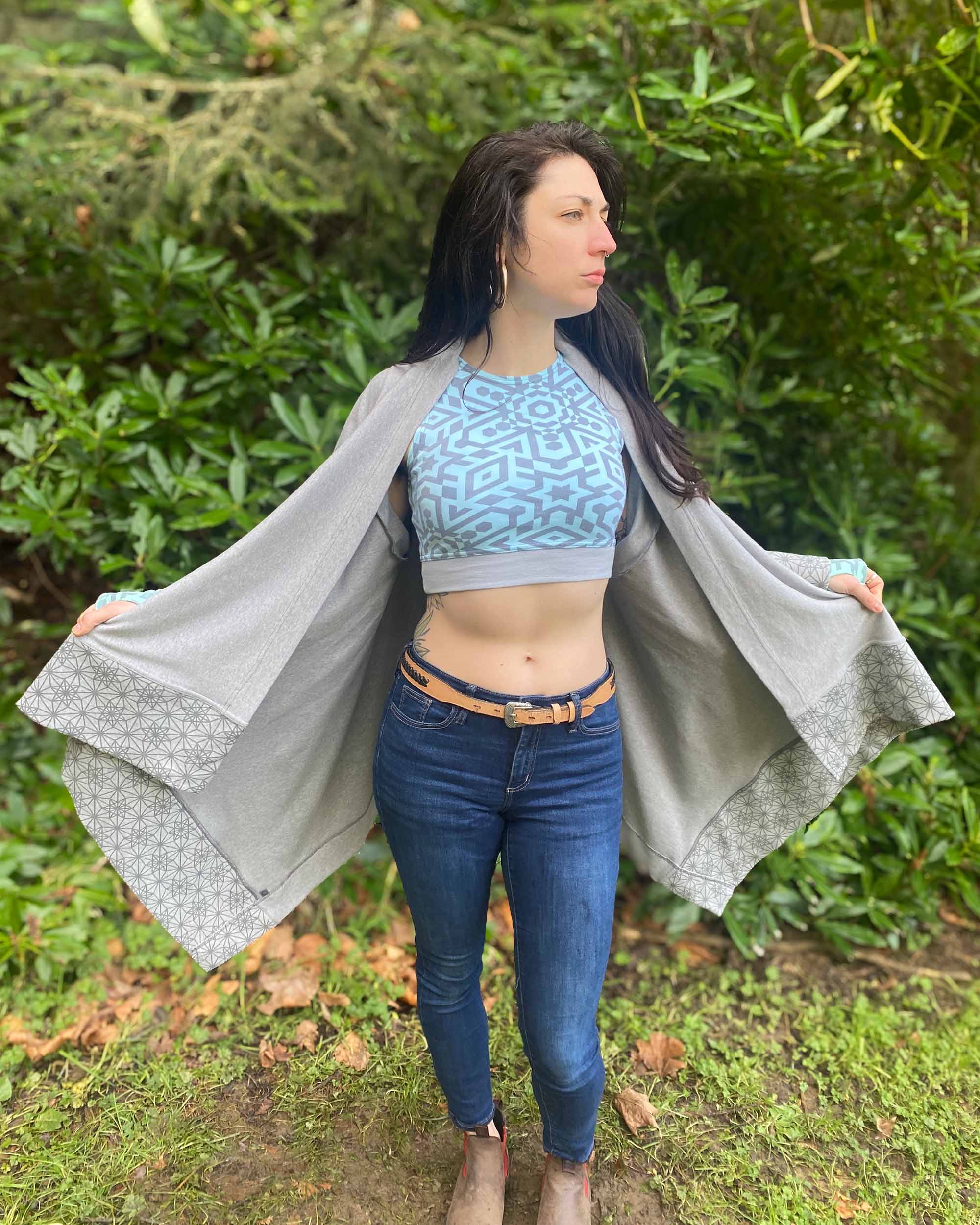 Organic cotton crop top, mint colored fabric with grey geometric print on female model.