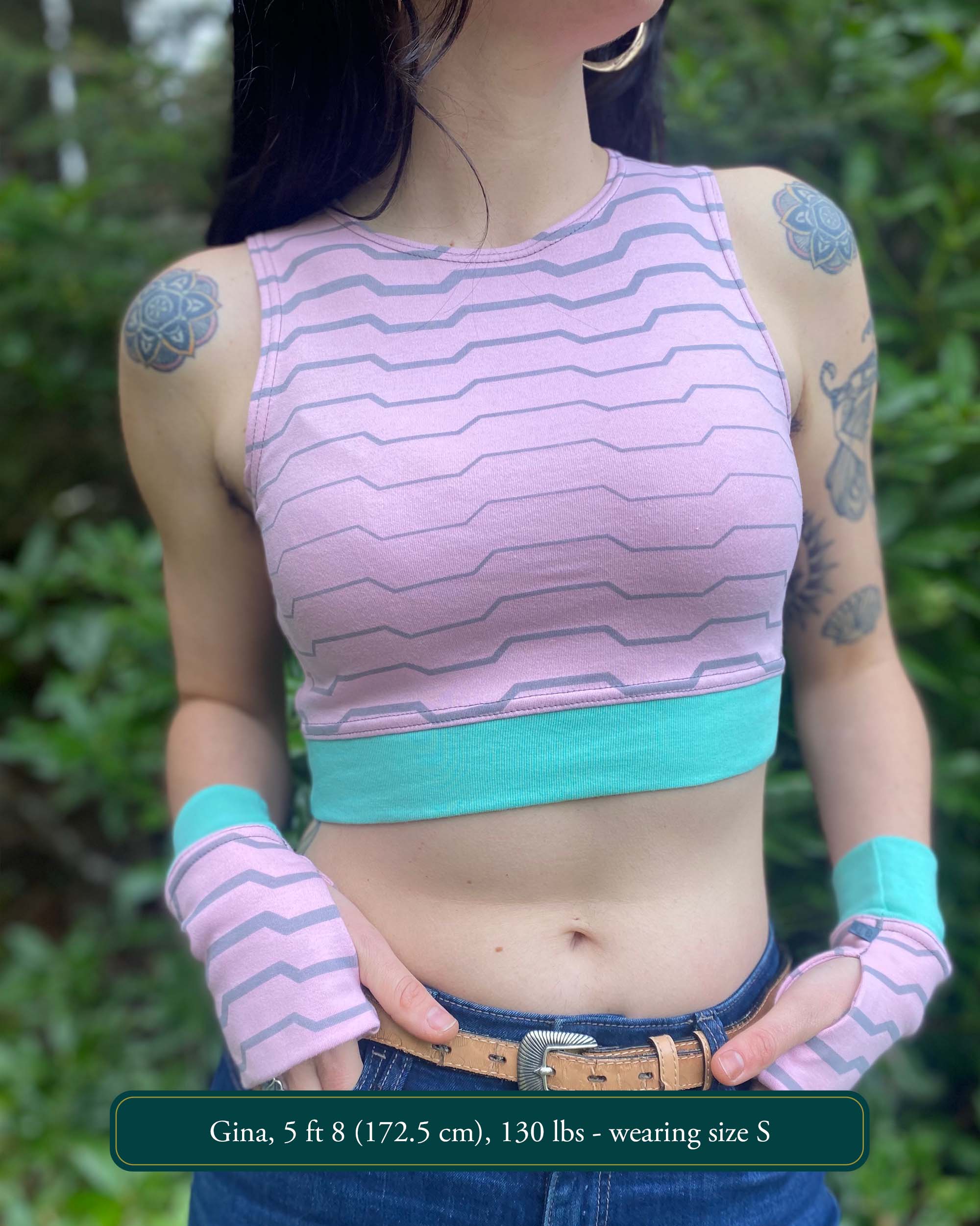 Organic cotton crop top, pink fabric with grey geometric print, front view on model.