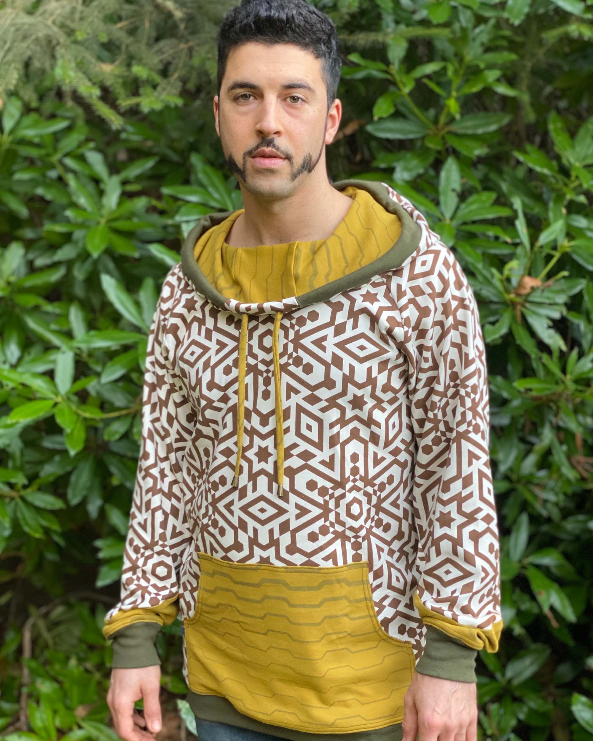 Organic cotton hoodie, un-dyed fabric with brown geo print, front view of male model.