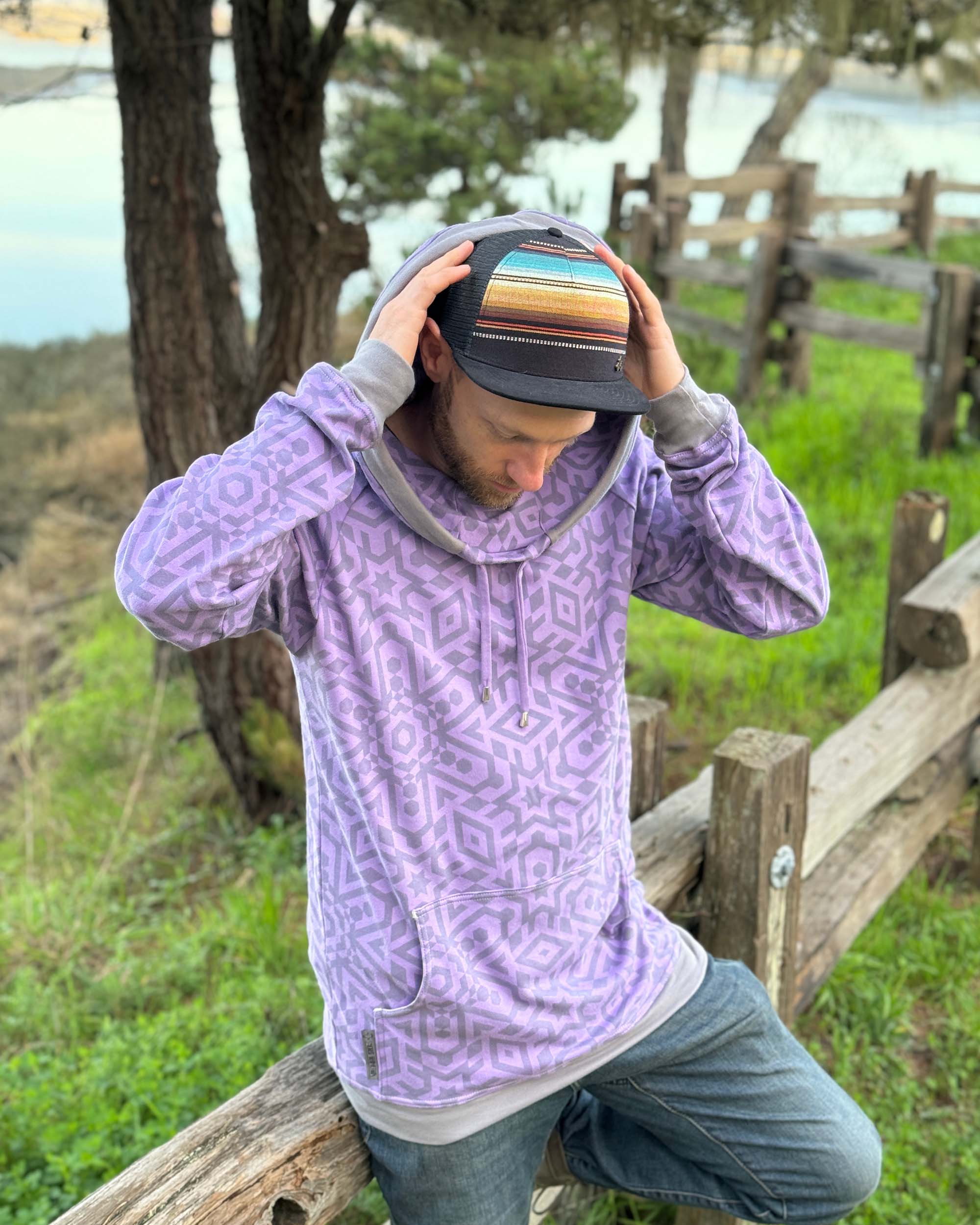 Organic cotton extra long unisex hoodie, lavender with geometric print, front view of male model.