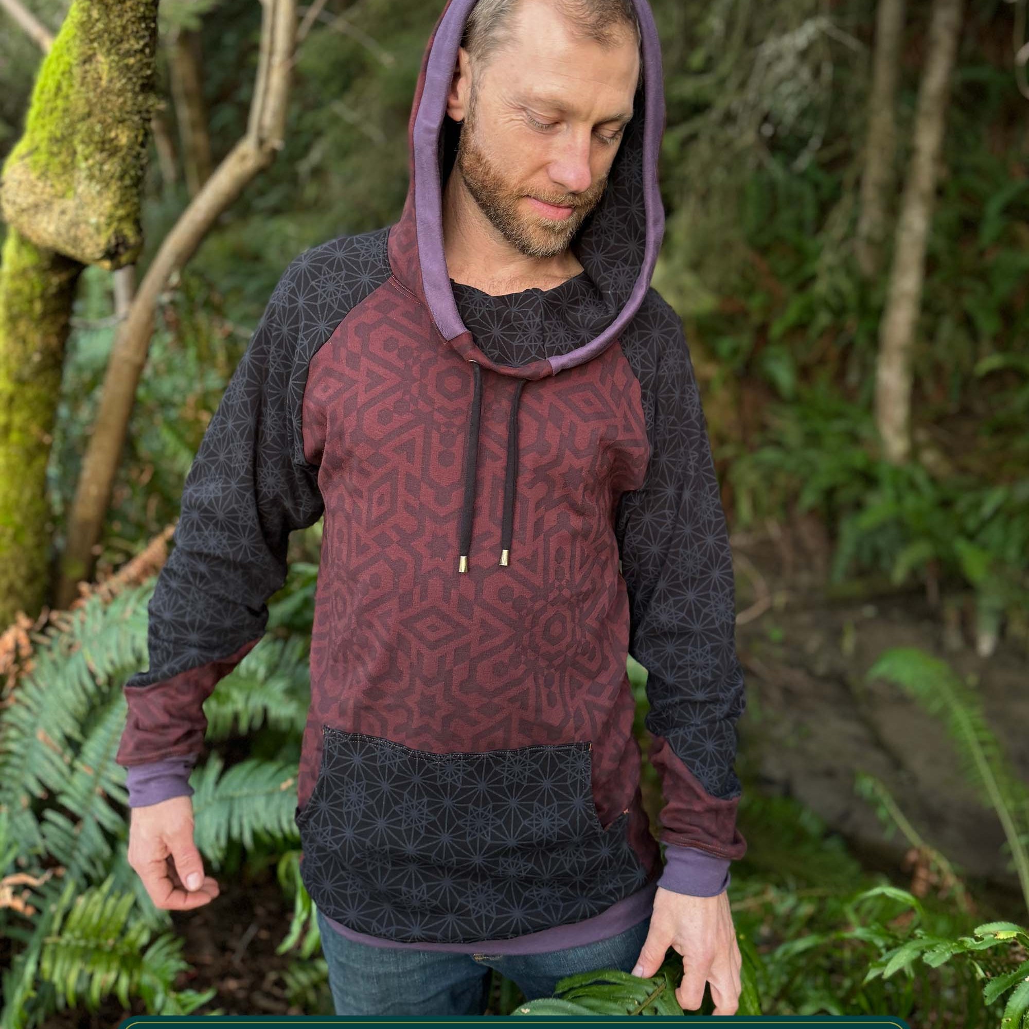 Organic cotton extra long unisex hoodie, reddish brown fabric with geometric print, front view of male model.