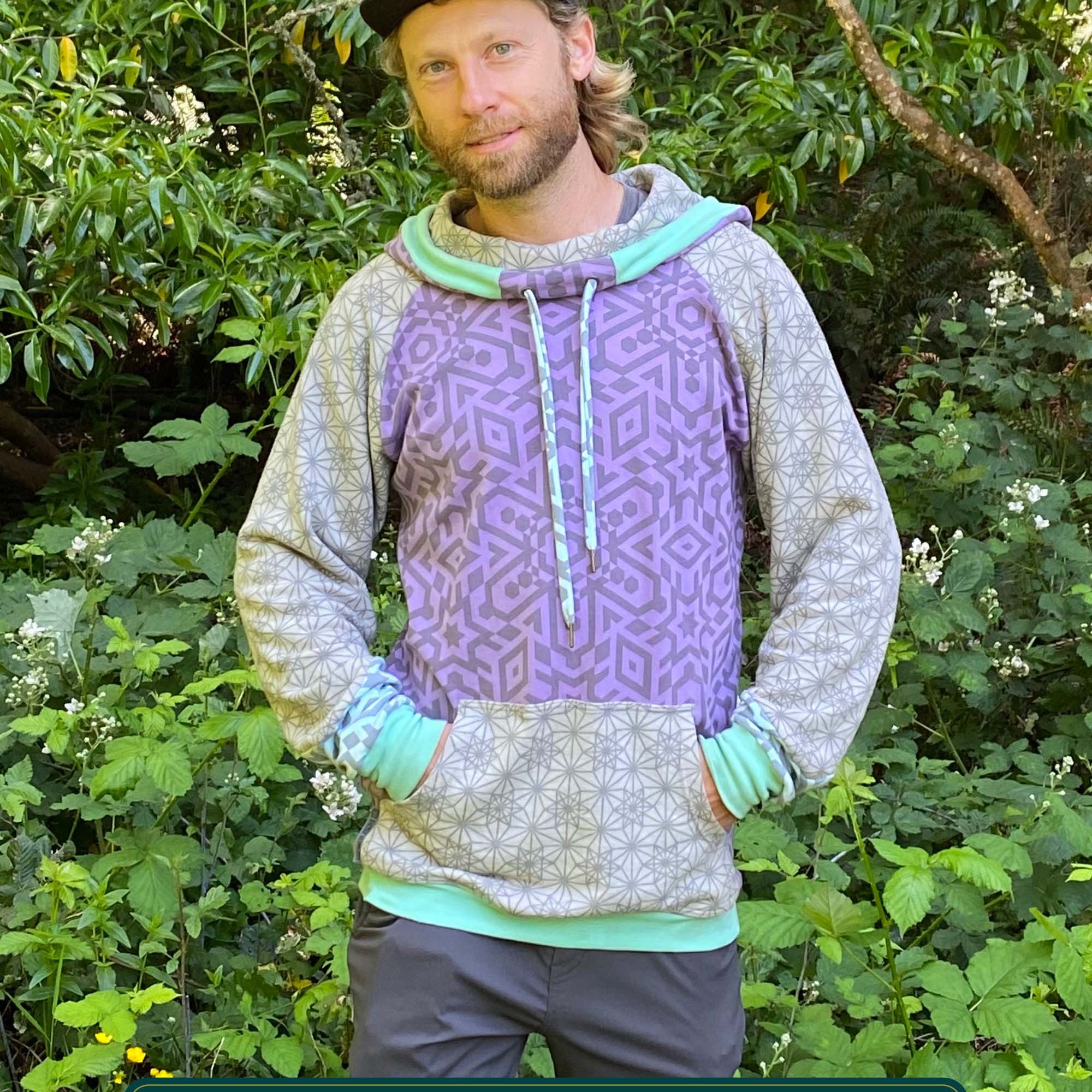 Organic cotton hoodie, lavender and grey fabric with geometric print, front view on male model.