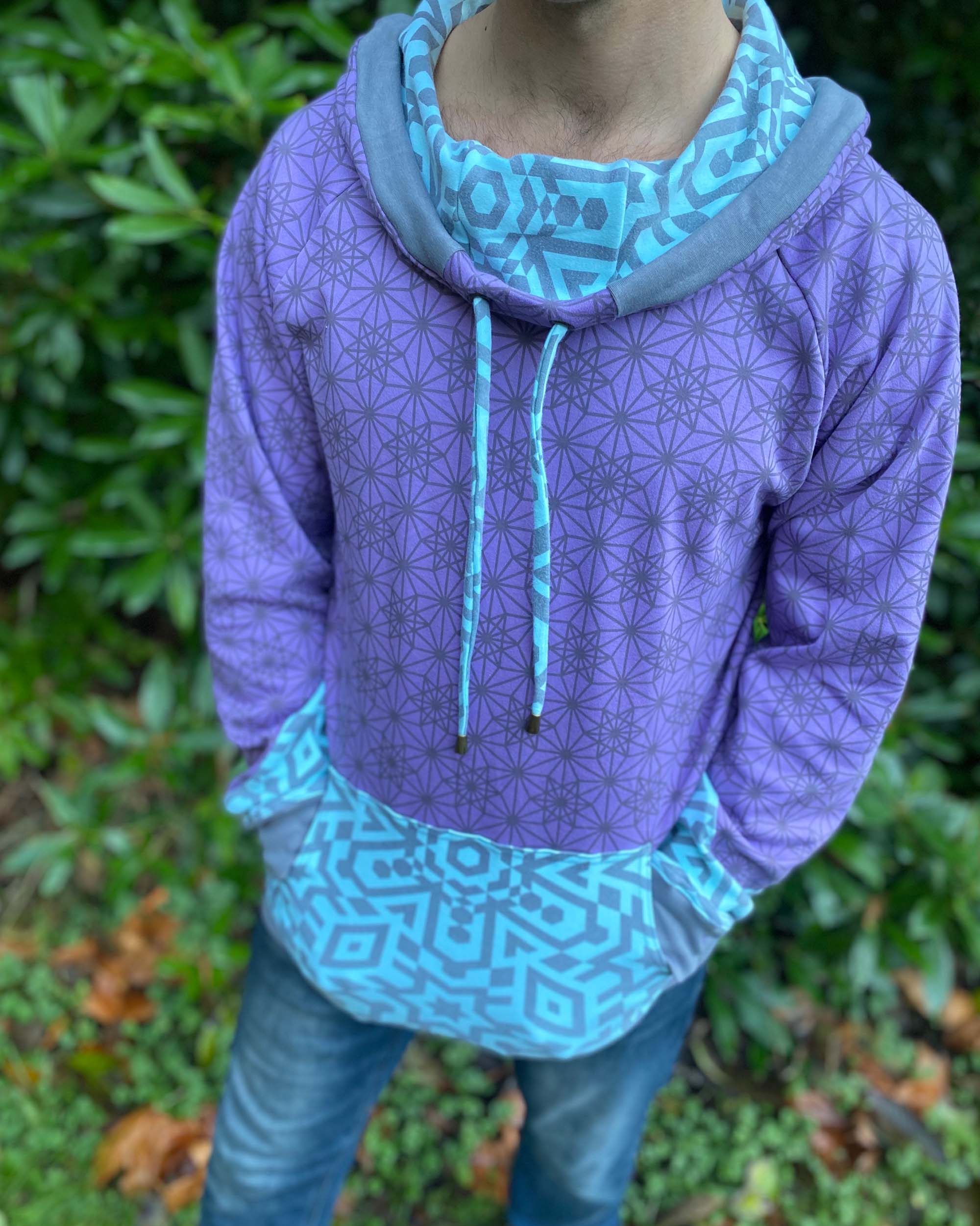 Organic cotton hoodie, lavender fabric with geo print, close up front view.