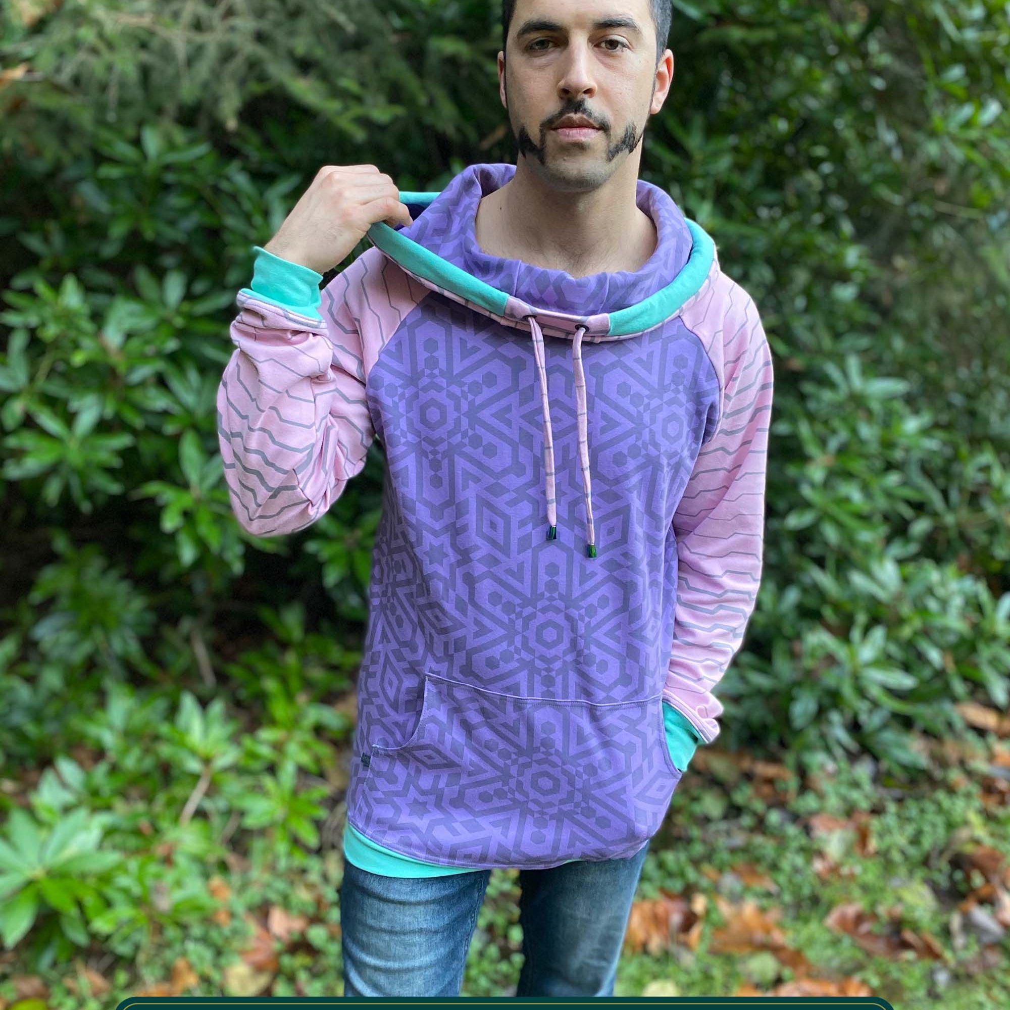 Organic cotton hoodie, lavender and pink fabric with geometric print, front view on male model.