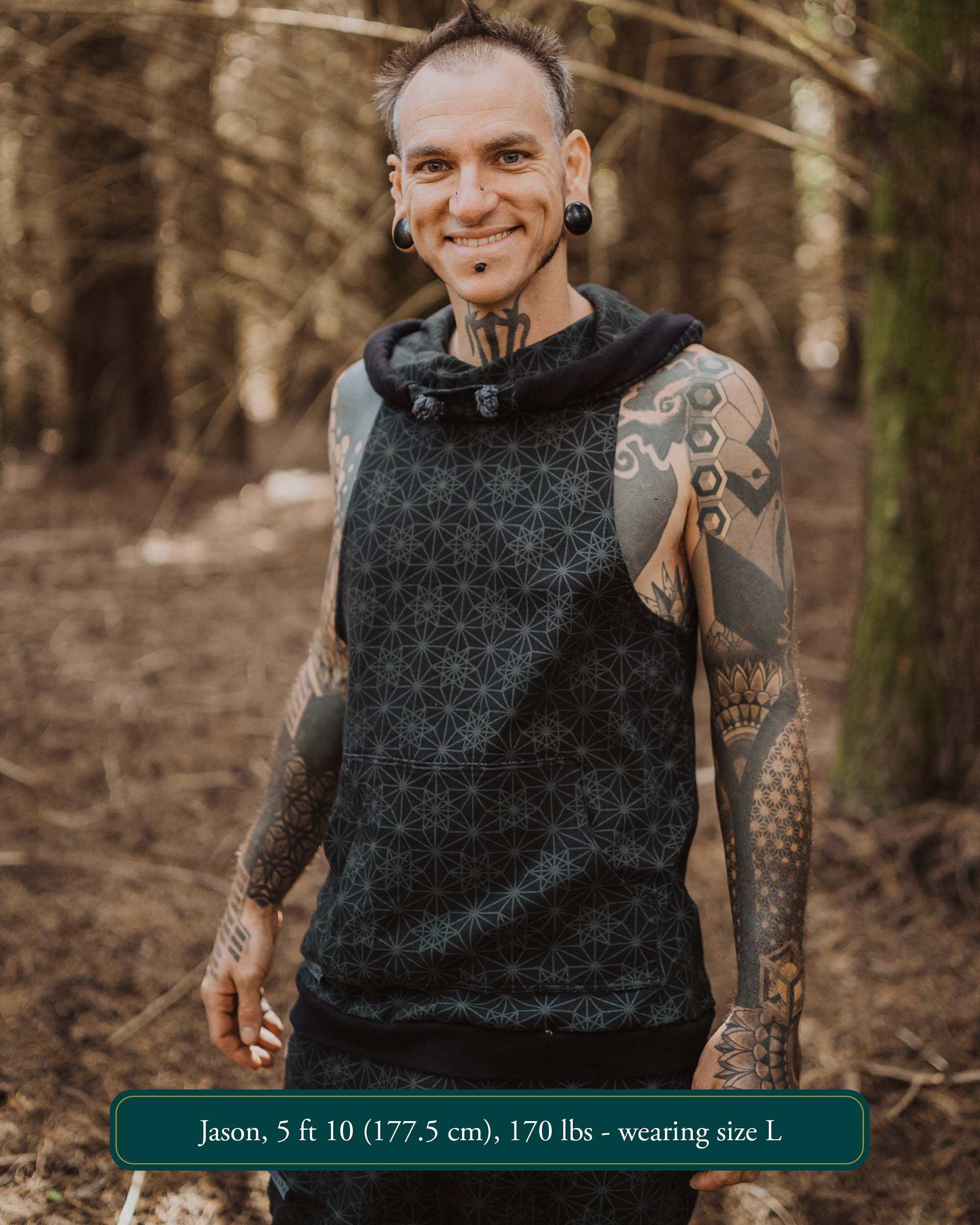 Organic cotton sleeveless hoodie, black with sacred geometry print, front view on male model.