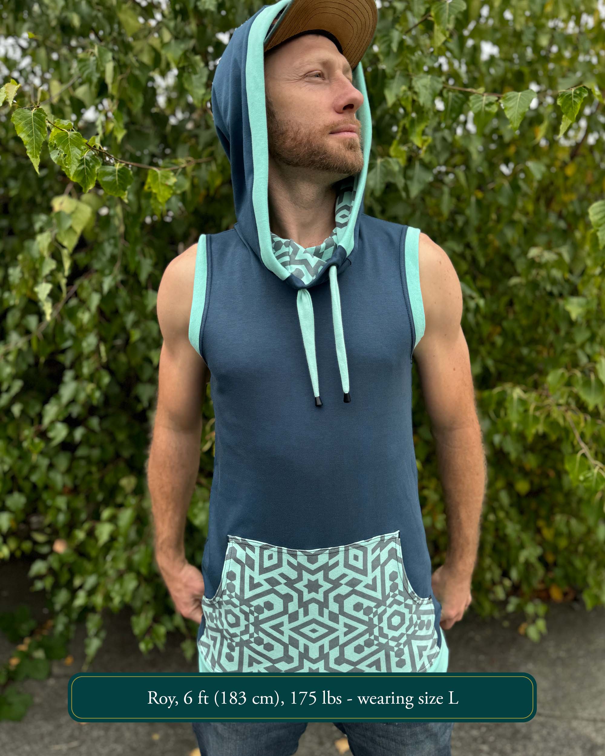 Organic cotton sleeveless hoodie, deep blue with mint geometric print accent fabric, front view on male model.