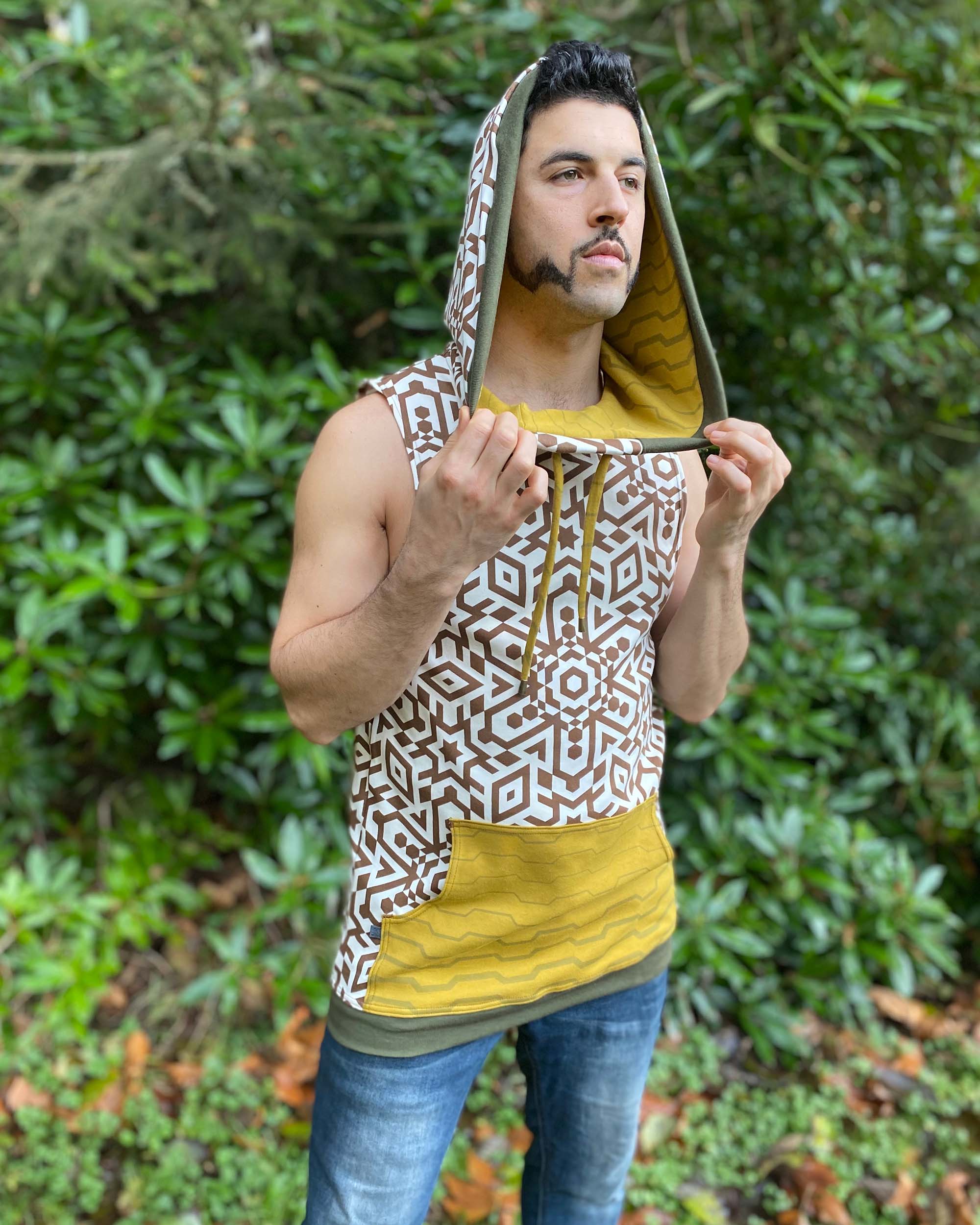 Organic cotton hooded tank top, undyed with brown geo print, front side view on male model.