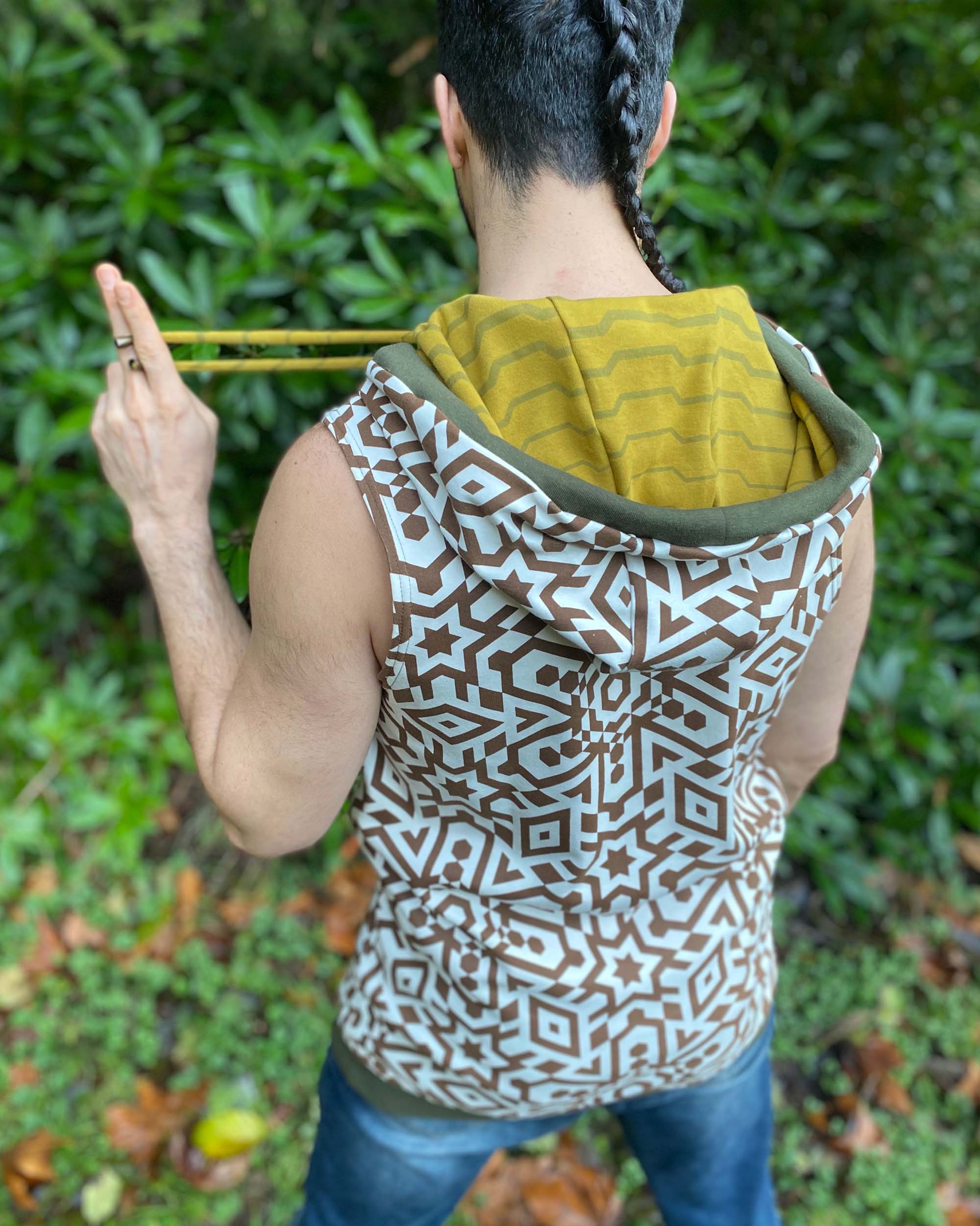 Organic cotton hooded tank top, undyed with brown geometric print, back side view of hood.