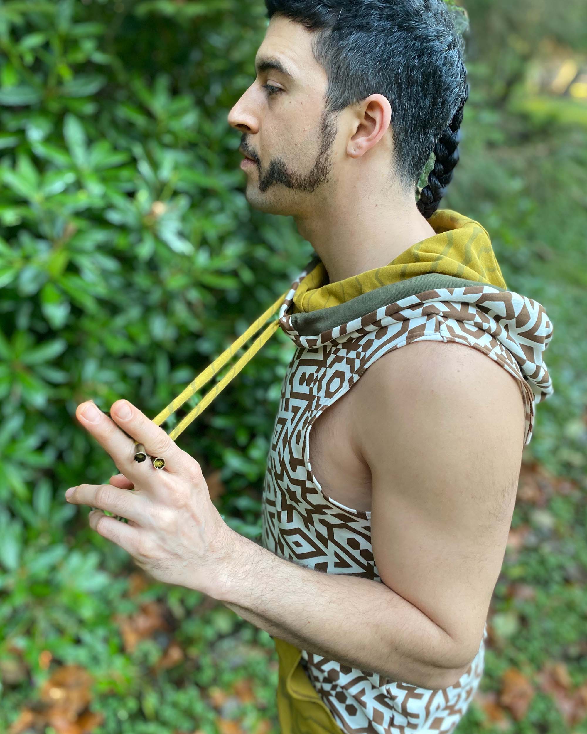 Organic cotton hooded tank top, undyed with brown geometric print, left side view.