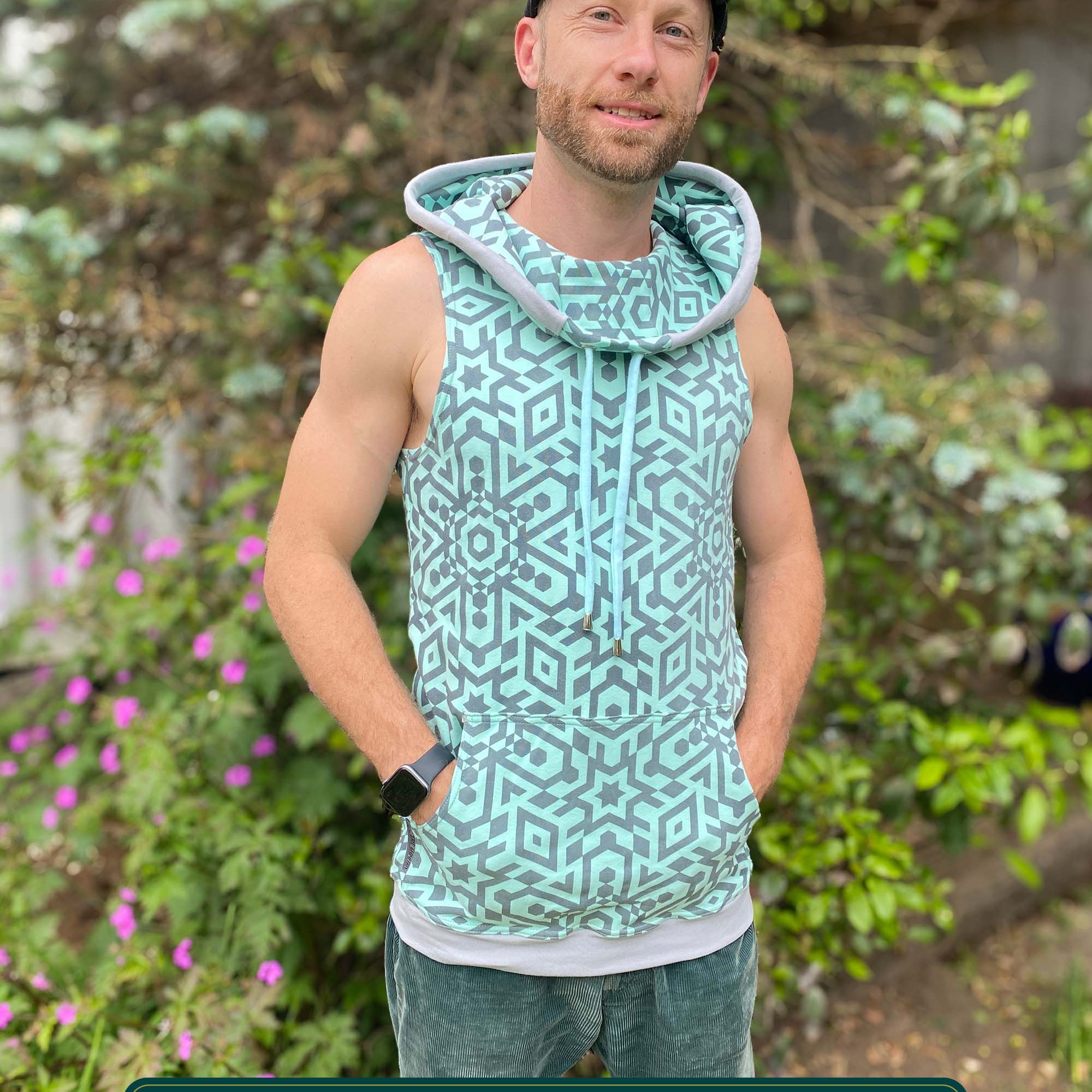 Organic cotton sleeveless hoodie, mint with geometric print fabric, front view on male model.