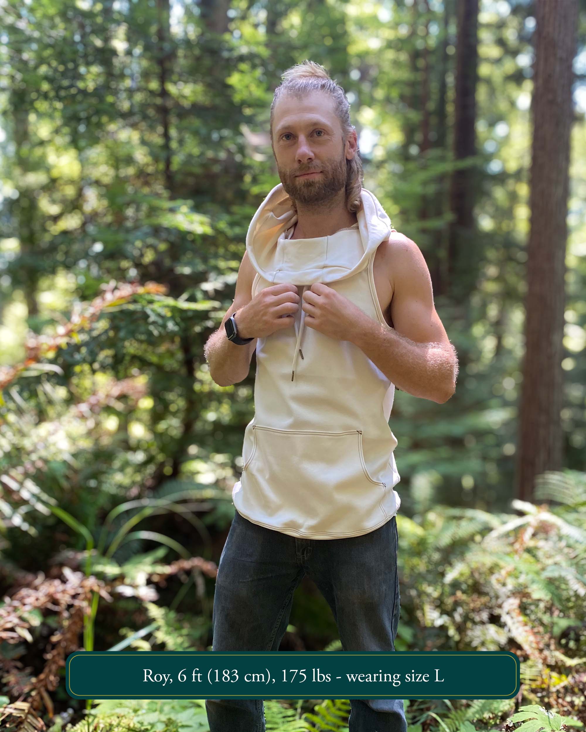 Organic cotton sleeveless hoodie, undyed fabric, front left side view on male model.