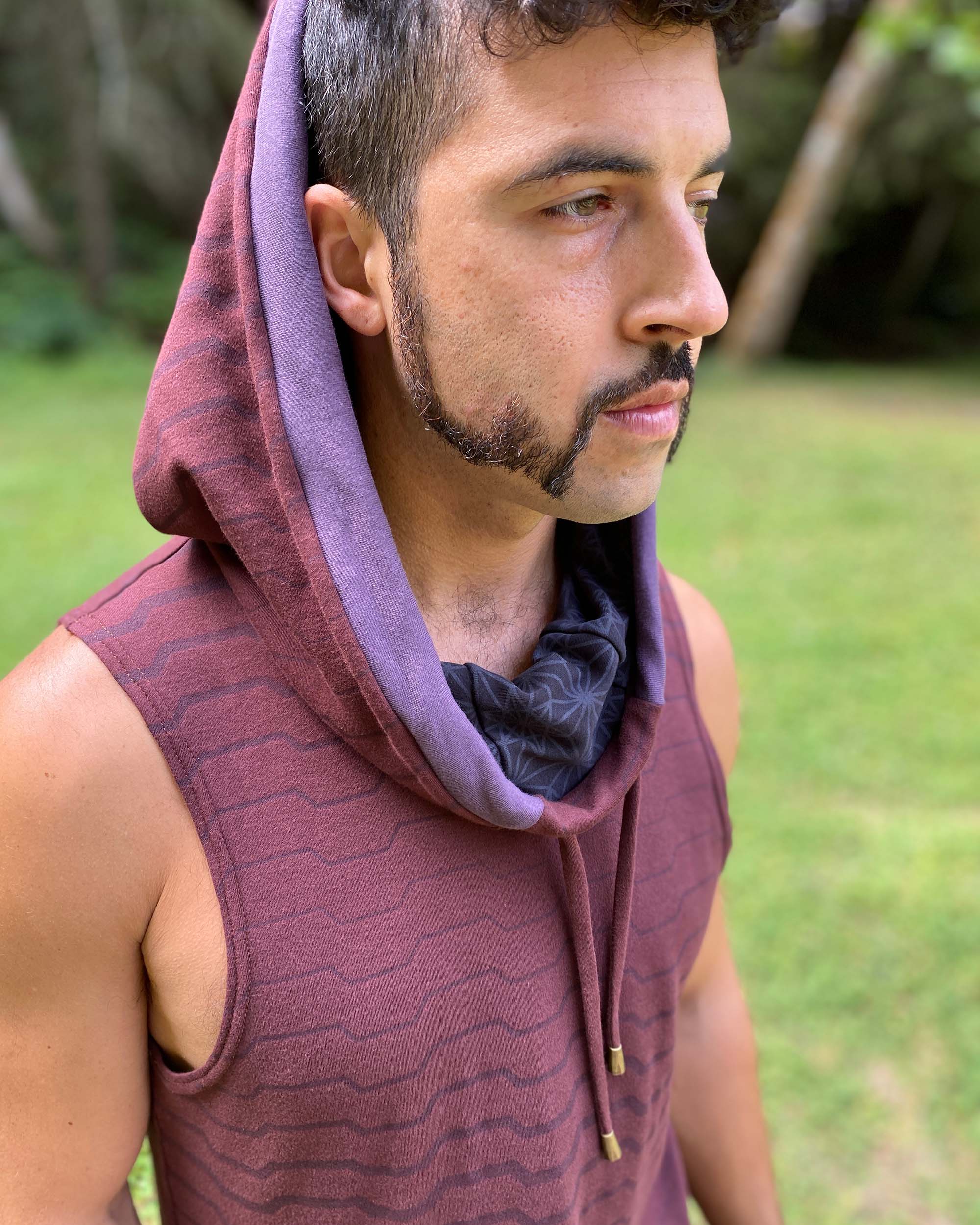 Organic cotton hooded tank top, brown with black accents and geometric print, detail view of hood.