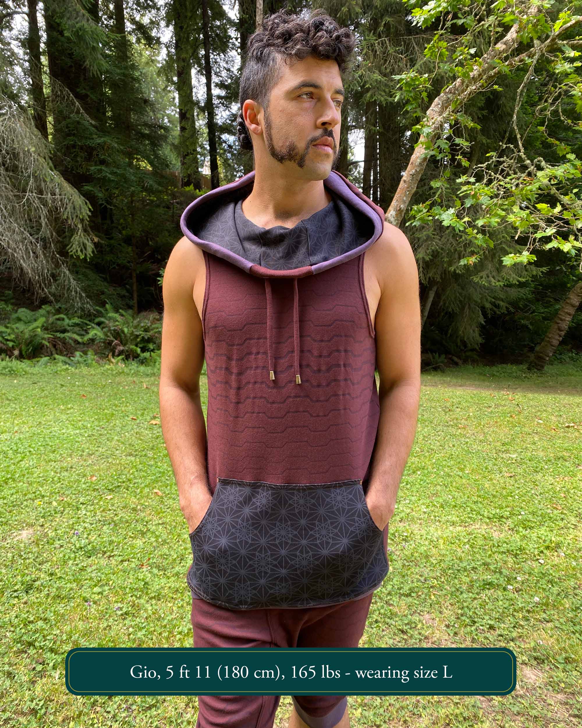 Organic cotton hooded tank top, brown with black accents and geometric print, front view on male model.