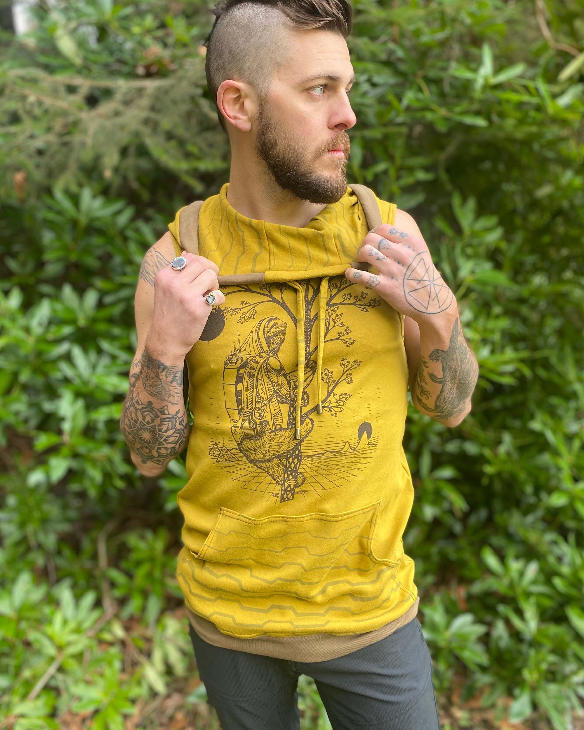 Organic cotton sleeveless hoodie, yellow fabric with sloth print, front view on male model.
