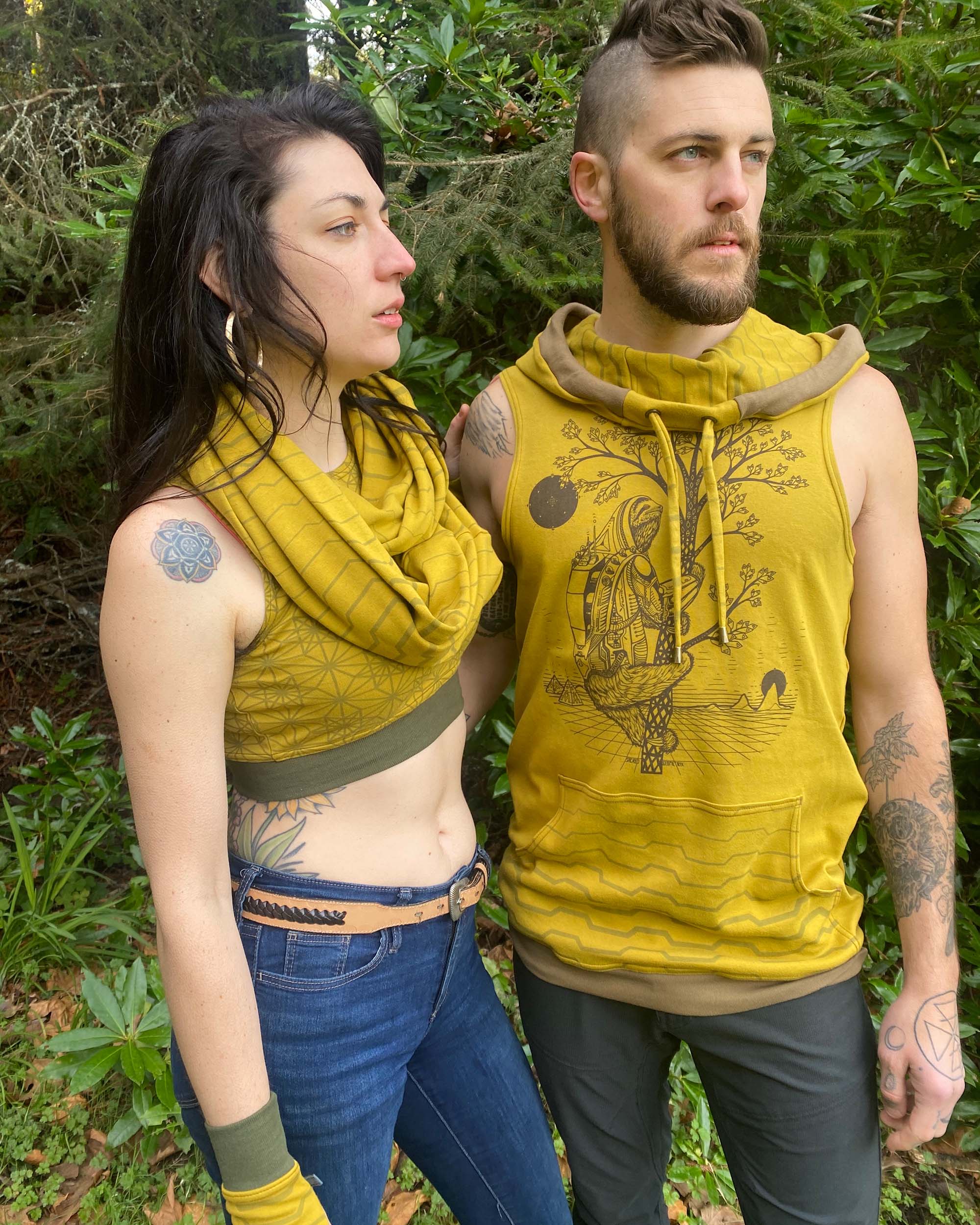 Organic cotton sleeveless hoodie, yellow fabric with sloth print, front view on male model with female model.