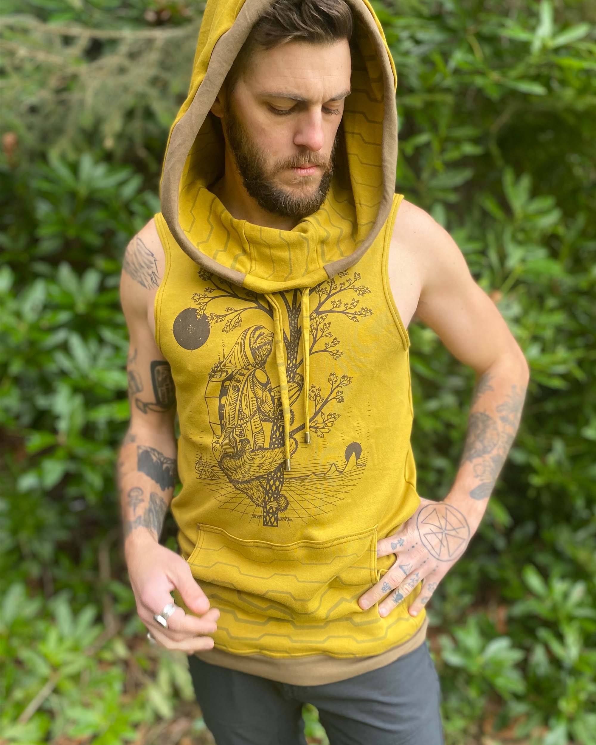 Organic cotton sleeveless hoodie, yellow fabric with sloth graphic, front view on male model.