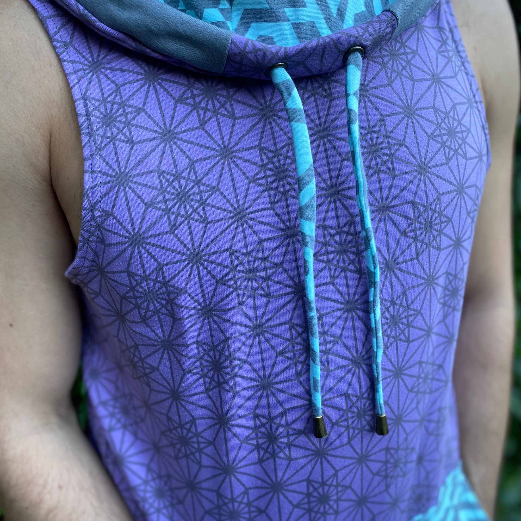 Organic cotton hooded tank top, lavender and mint fabric with geometric print, detail view of fabric.