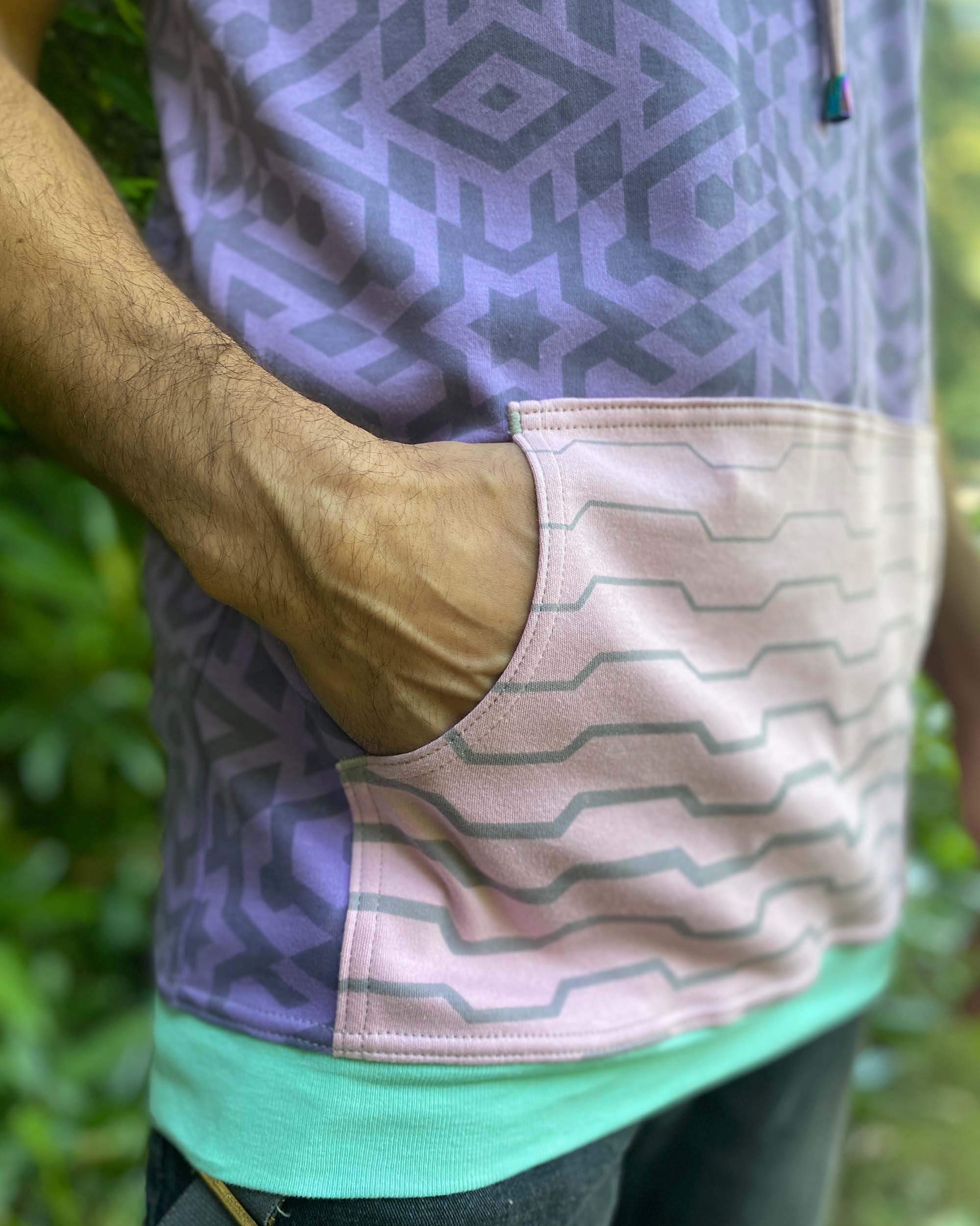 Organic cotton hooded tank top, lavender and pink geometric printed fabric, detail view of pocket.