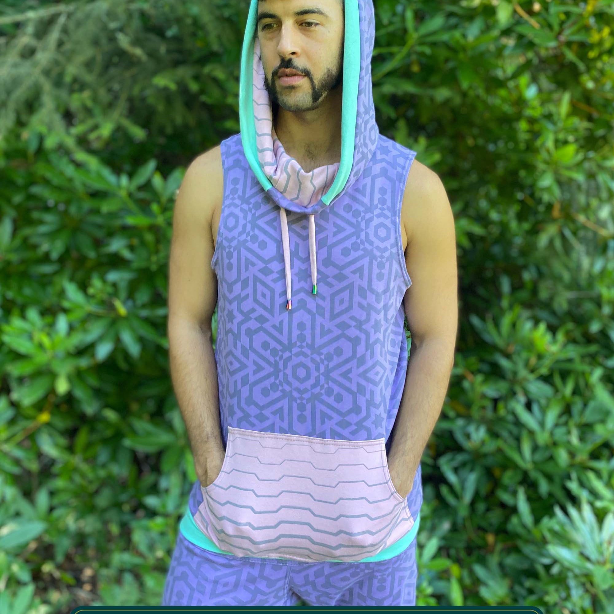 Organic cotton hooded tank top, lavender and pink geometric fabric, front side view on male model.