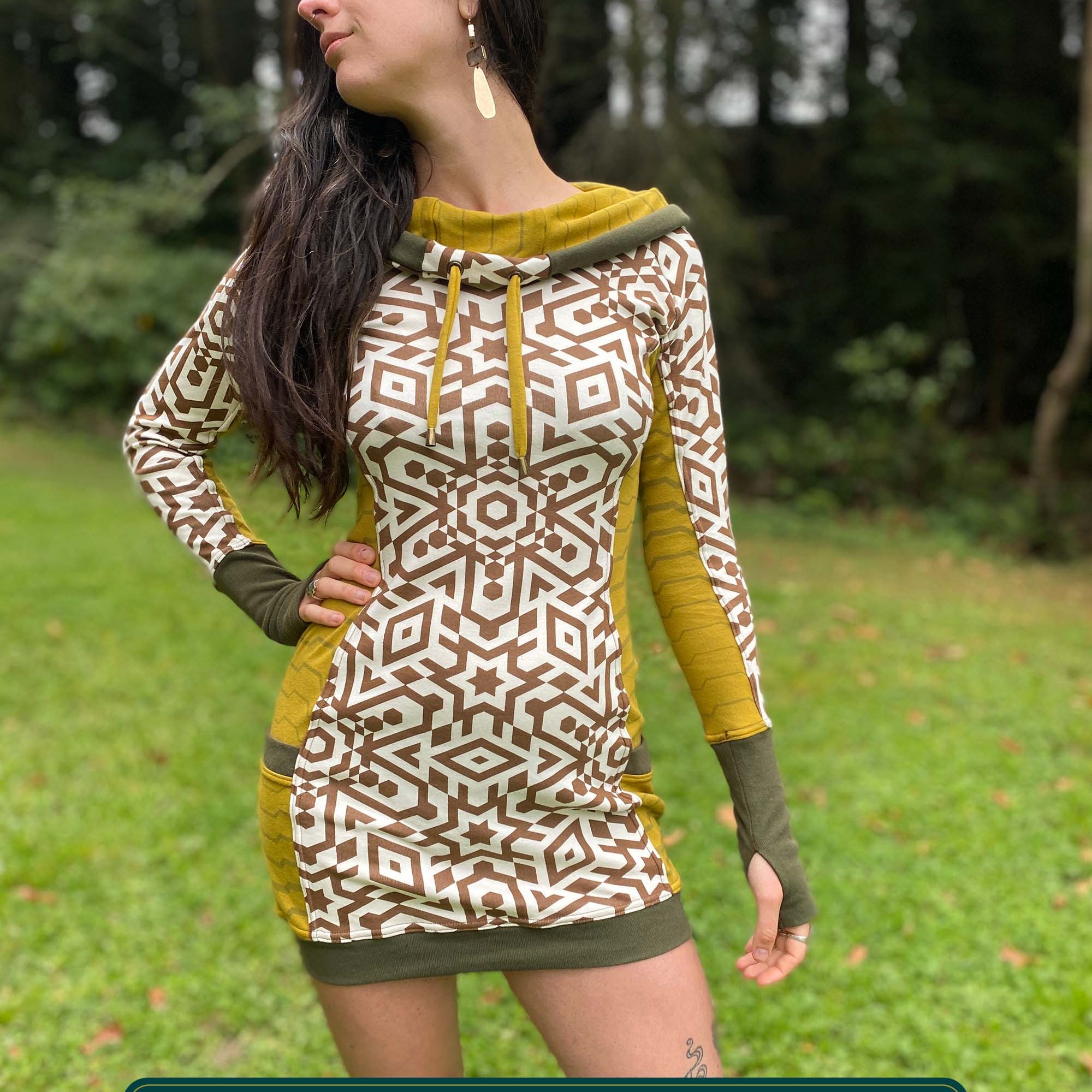 Organic cotton hooded tunic dress, undyed and yellow fabric with geometric print, front view on model.